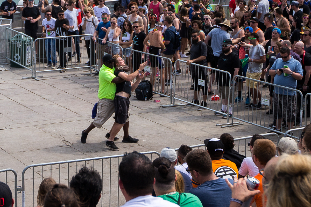  A man is tackled by a security guard after jumping over a gate at the Pyramid Stage at Hart Plaza in downtown Detroit for day two of Movement Electronic Music Festival on Sunday, May 28, 2017. Over 100 artists are scheduled to perform over the three