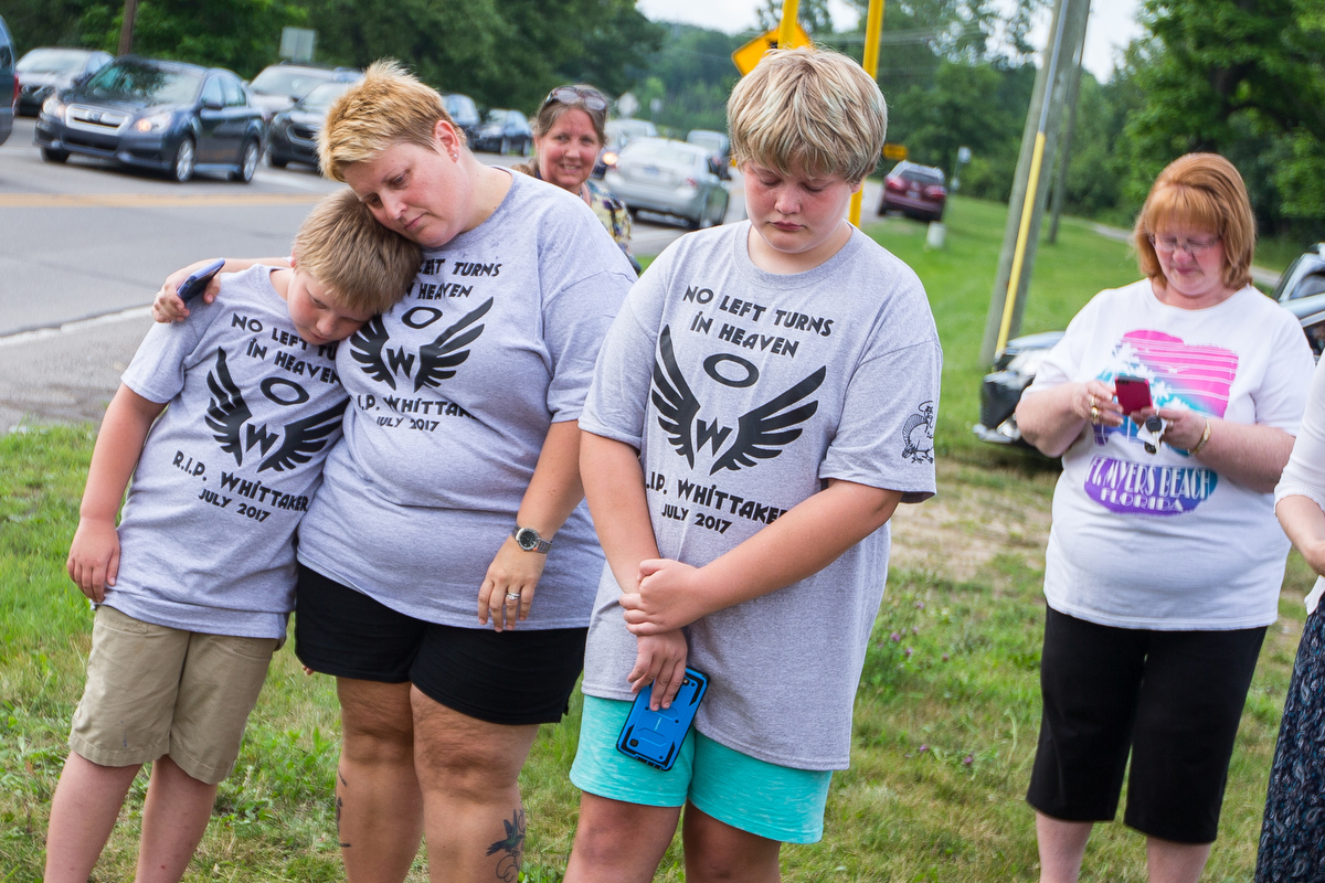  Drew Palmquist, 8, left Melissa and Kyla, 11, mourn Whittaker the Ypsilanti Turkey during a funeral for him at the intersection of Whittaker Road and Textile Road in Ypsilanti on Thursday, July 13, 2017. Whittaker was hit by a car on Monday, July 3 