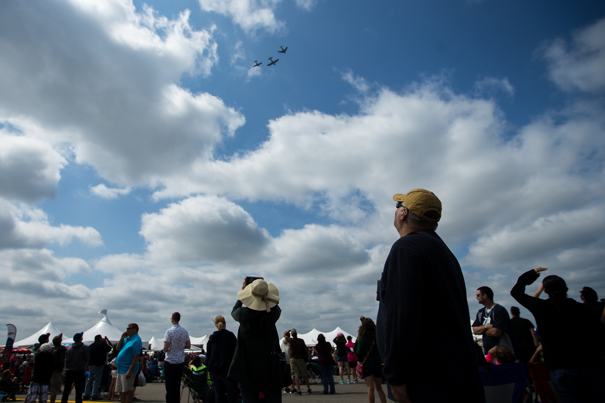  People look at airplanes flying at the Thunder Over Michigan Air Show at Willow Run Airport on Sunday, September 3, 2017. Matt Weigand | The Ann Arbor News 