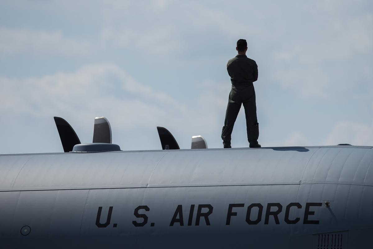  An individual looks at airplanes flying at the Thunder Over Michigan Air Show at Willow Run Airport on Sunday, September 3, 2017. Matt Weigand | The Ann Arbor News 