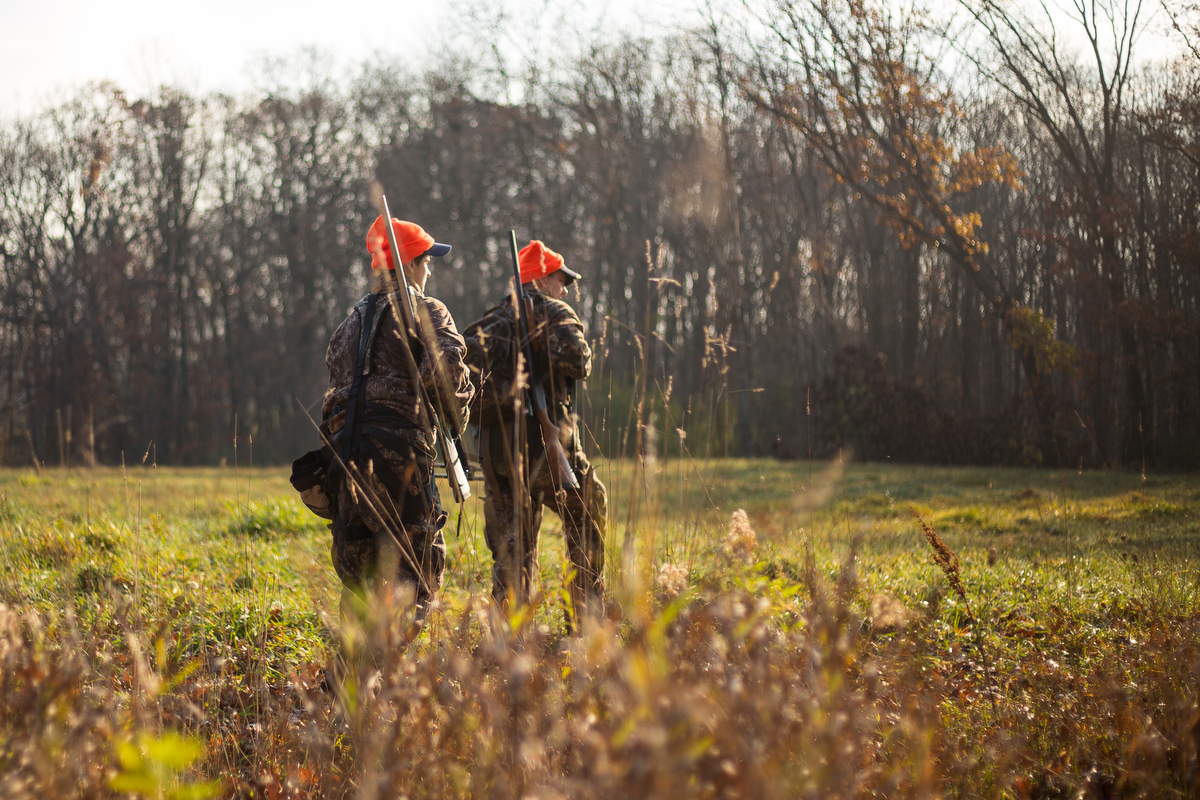  Ricky Taylor, 12, left and his father Rick walk through a meadow while hunting near Chelsea on Tuesday, November 16, 2016. Rick took his son Ricky hunting on opening day of deer hunting for his first time hunting with a rifle. Matt Weigand | The Ann