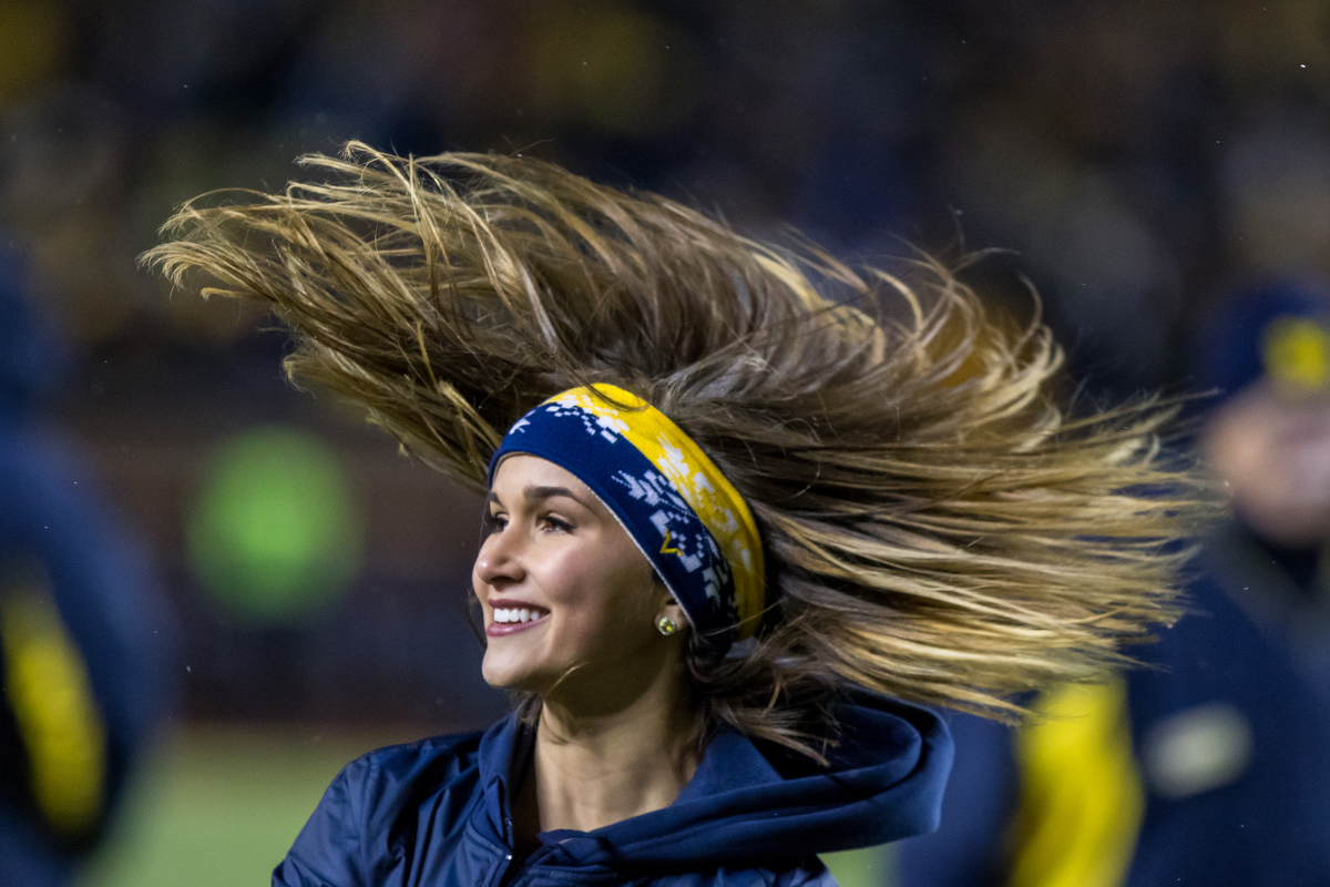  A Michigan dance team member dances during the second half of play against the Indiana Hoosiers at Michigan Stadium on Saturday, November 19, 2016. Michigan beat Indiana 20-10. Matt Weigand | The Ann Arbor News 