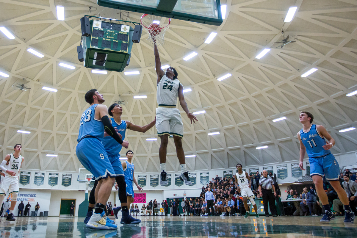  Huron High School's Lawrence Rowley (24) dunks the ball during the second half of play against Skyline High School at Huron High School on Friday, December 16, 2016. Skyline High School beat Huron High School 95-92 in triple overtime. Matt Weigand |