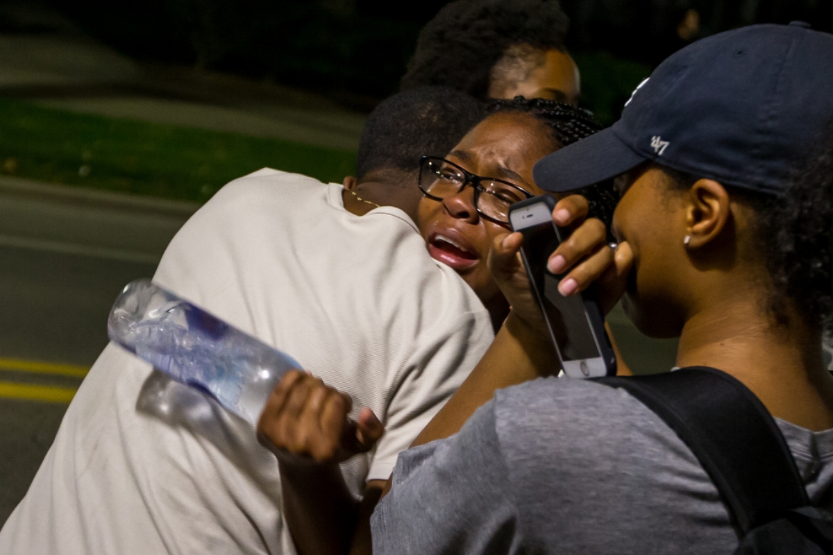  People cry after a protest turned violent on Wednesday, September 20, 2017. The group organized at the Michigan Union to address the recent incidents of racism on campus. Matt Weigand | The Ann Arbor News 