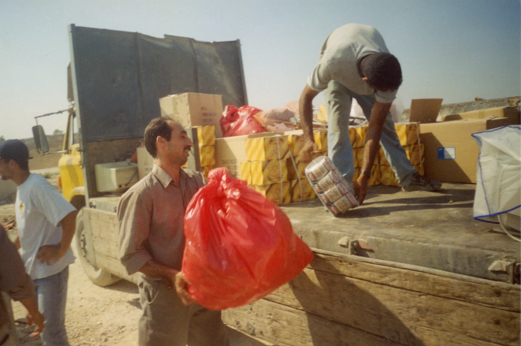The trust between Windows' community is based, among others, on the solidarity and support shown in hard times. A truck filled with food for Tulkram refugee camp, Summer 2003.