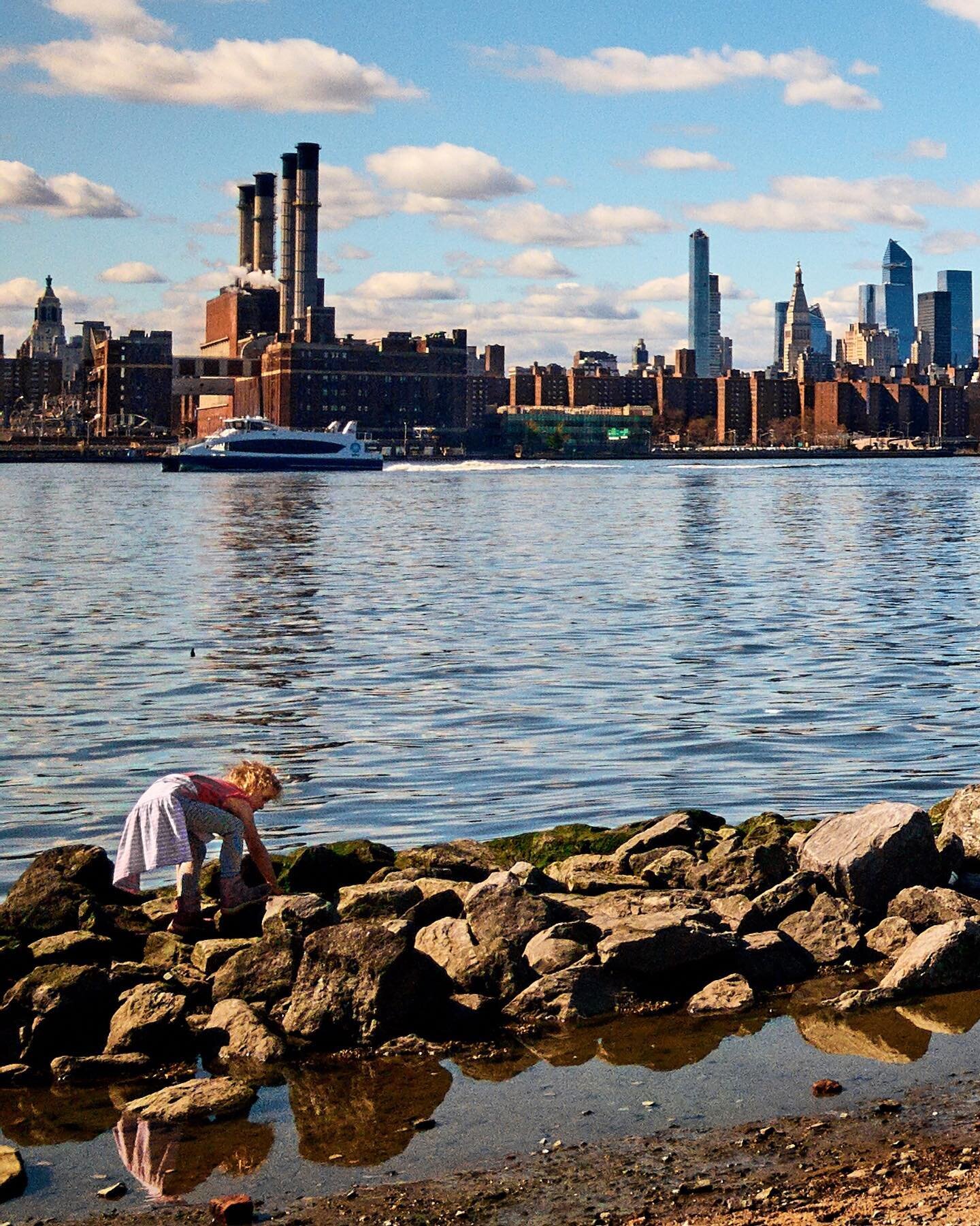 A weekend ago, you could almost pretend it was a perfect day: children playing on the beach in the sunshine, with pictureresque clouds over a Manhattan horizon.

But if you turned back, we&rsquo;re all wearing face masks, sitting at a distance. While