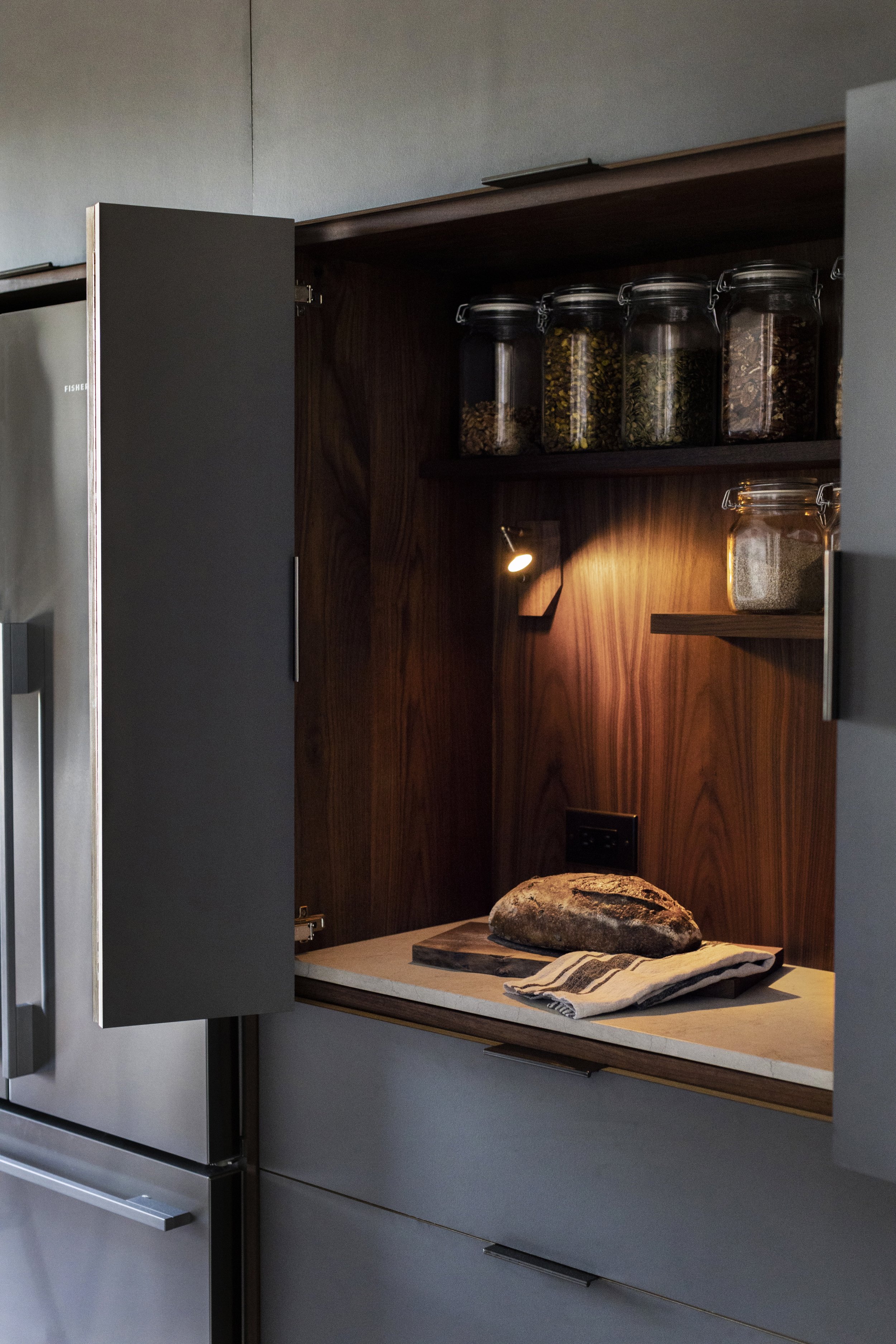  Bread nook, shows contrast of black walnut interior and Abet Laminate “magnetic” super matte finished slate grey laminate.   