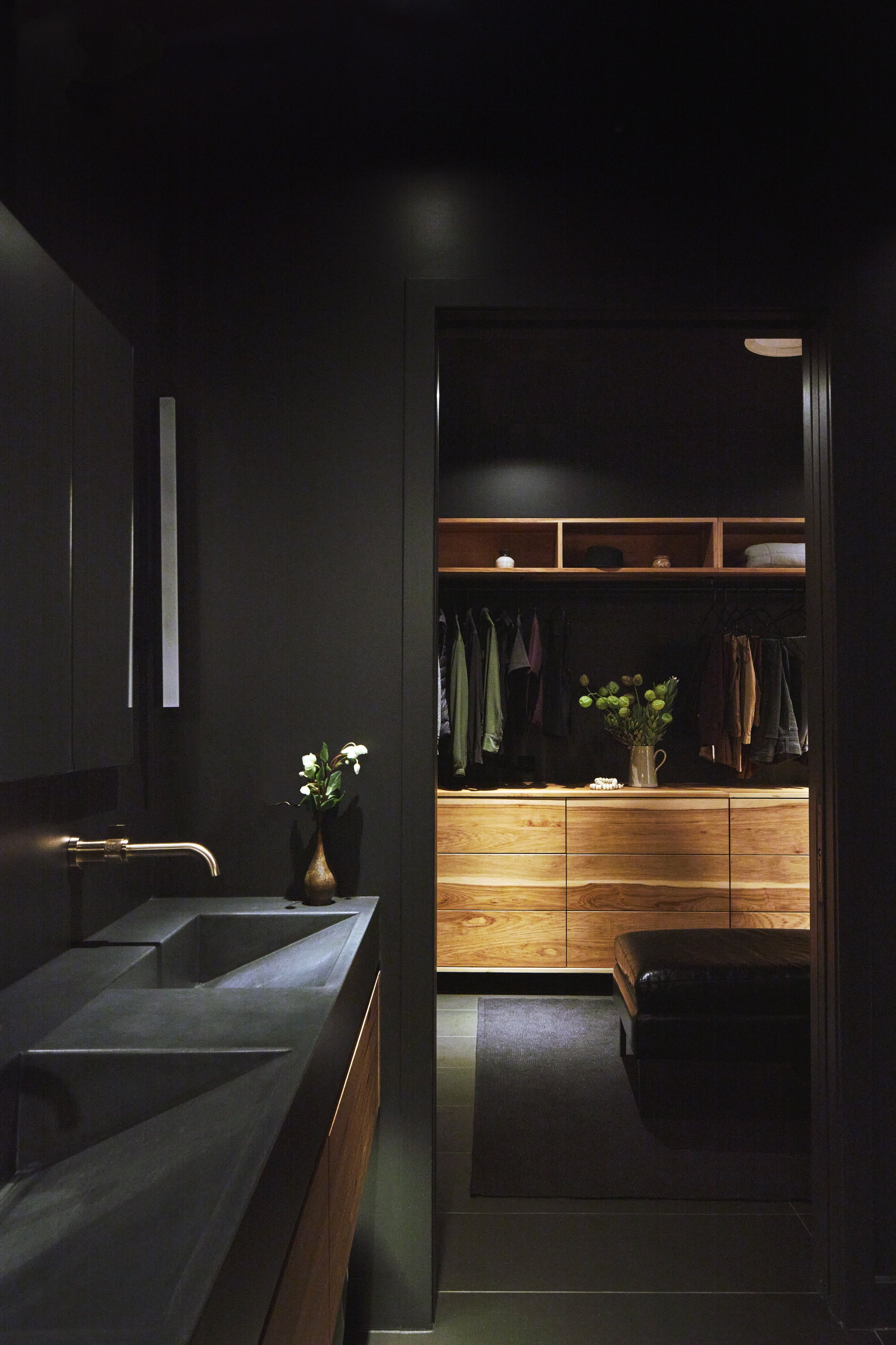  Bathroom is entry into luxurious dressing room illuminated by solid Hickory cabinets 