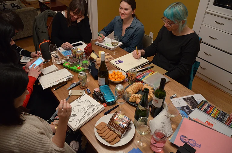 (pictured here, from the right around the table is Lena Podesta, Adrienne Vita, Vera Brosgol, Peg Serena, Tara Lilly, Kinoko Evans, and the little blue person on pink paper is by Rilla Alexander) 