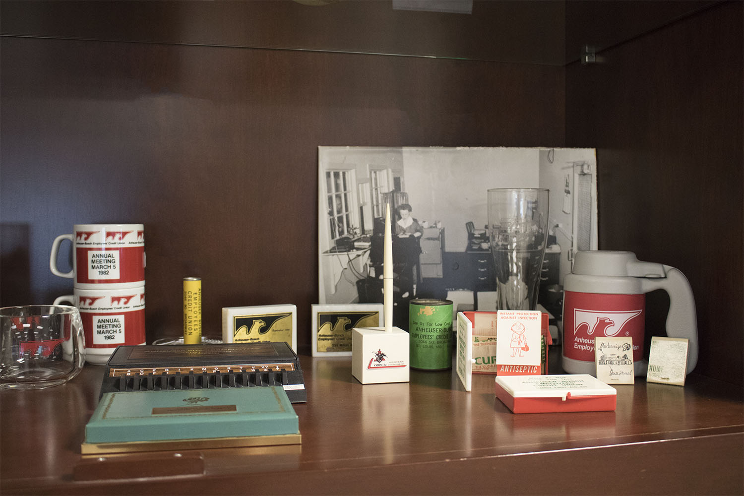 ABECU promotional items, giveaways, and photos from previous years displayed.