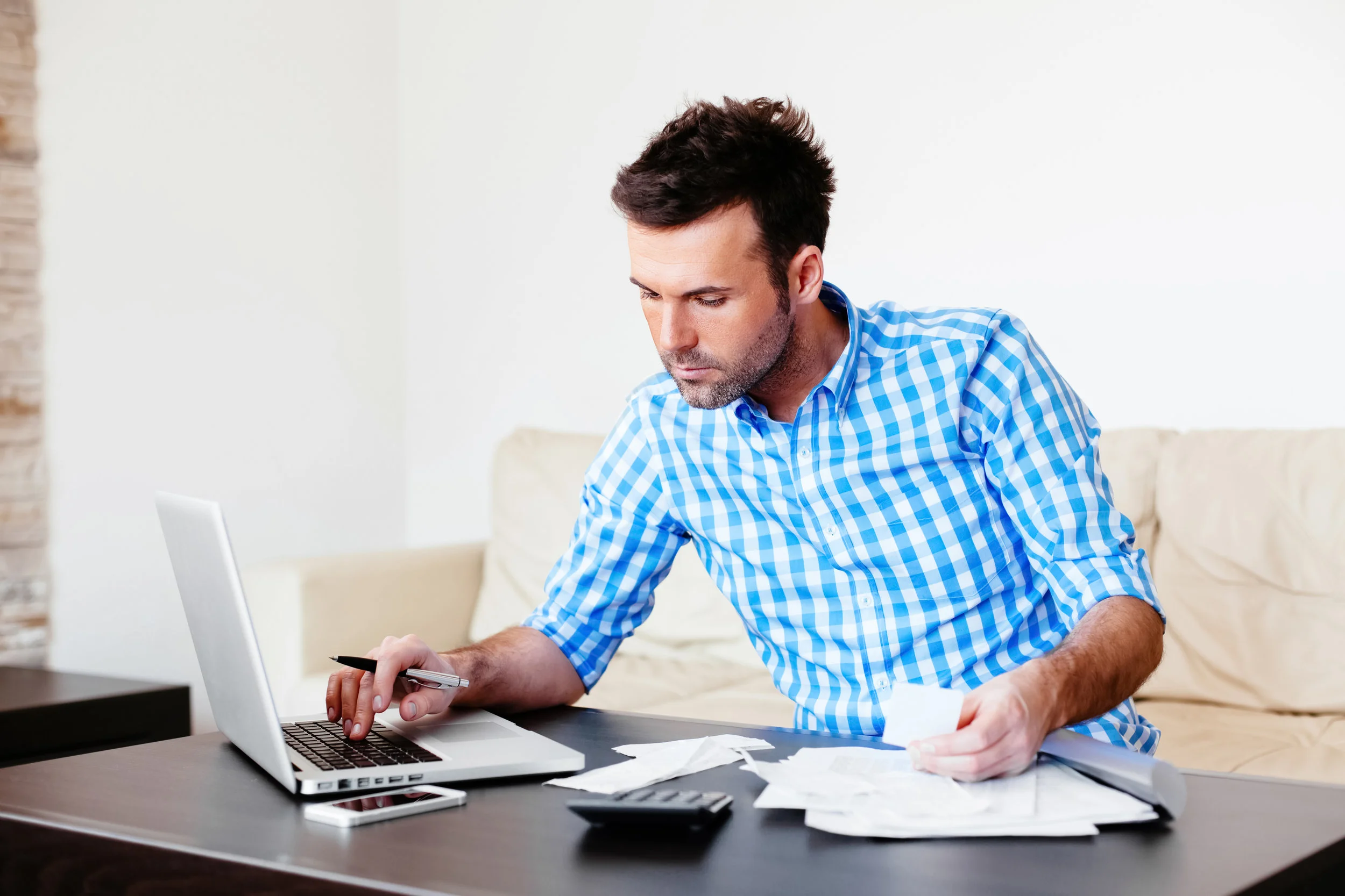shutterstock_191108723_paying_bills_man.jpg