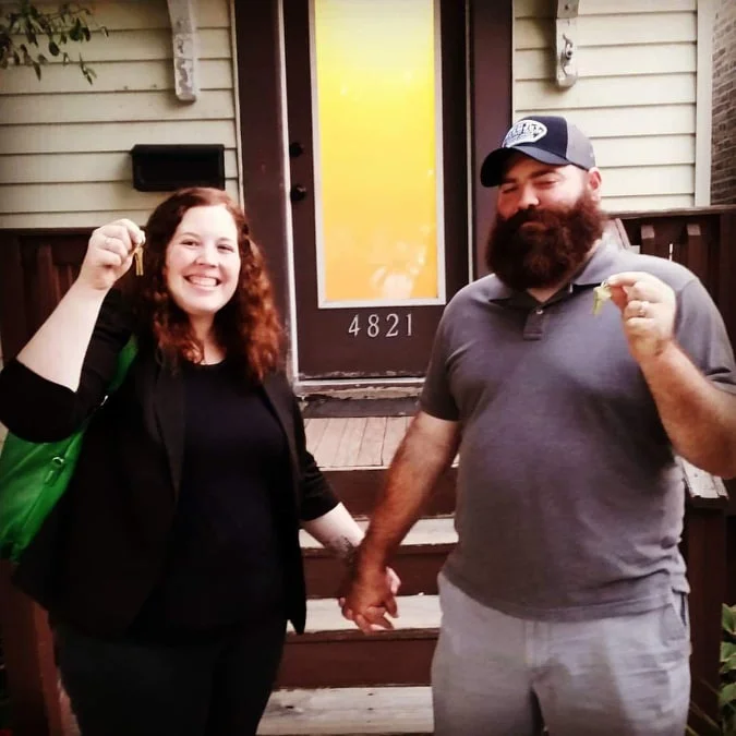Katie and husband, Andrew, in front of their home. Photo submitted with approval by Katie M.