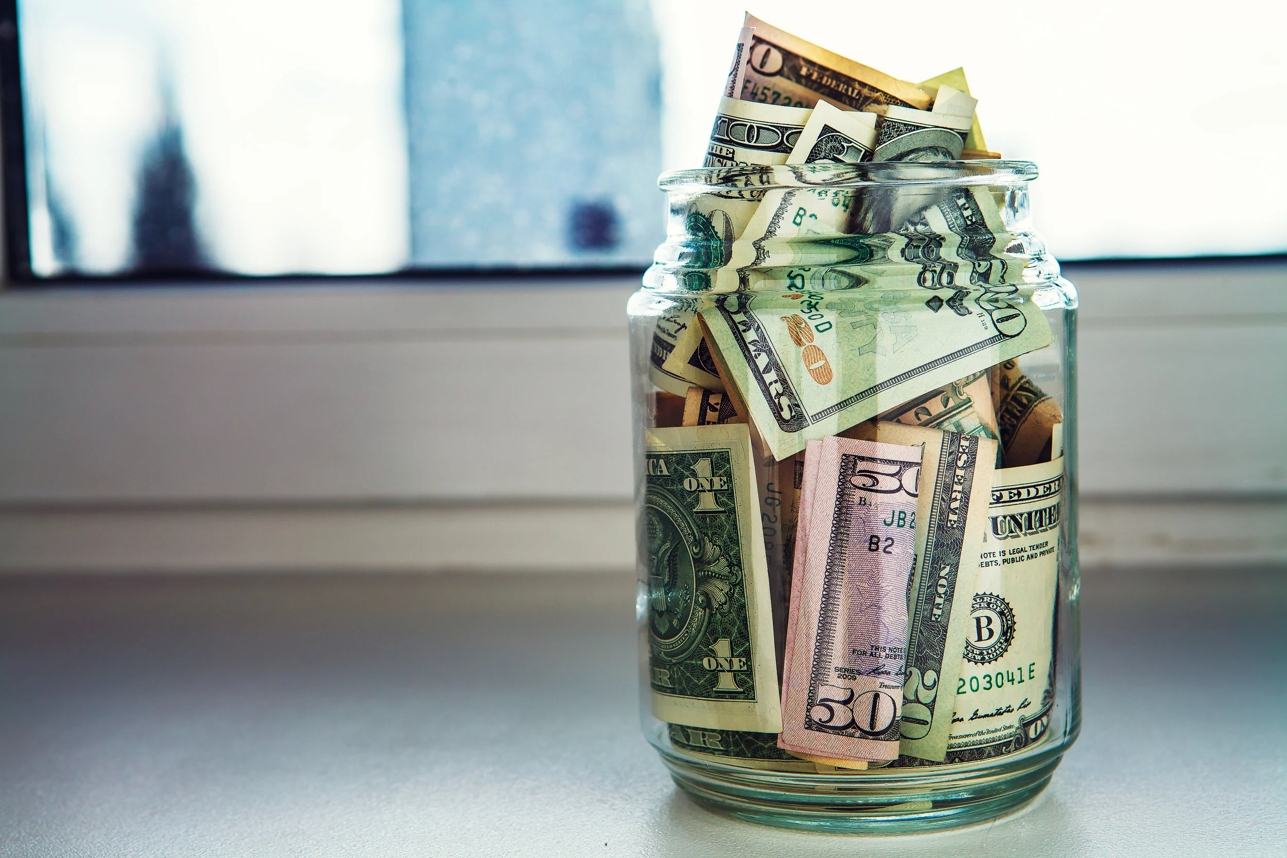 We’re not opposed to saving some cash in a jar, but why keep it there when you can earn interest with a financial institution?