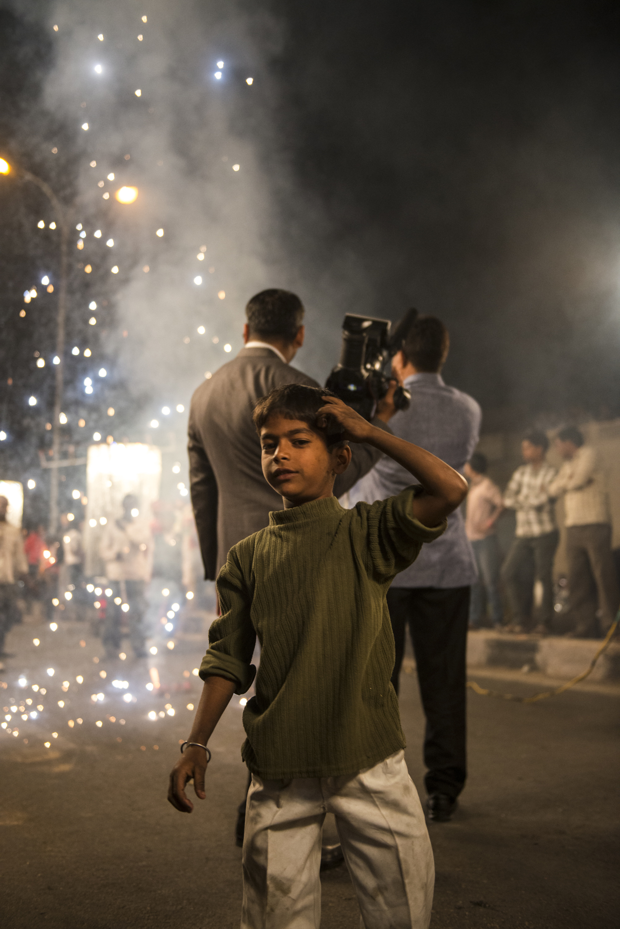 Indian child spectates a huge Indian wedding in Jaipur.