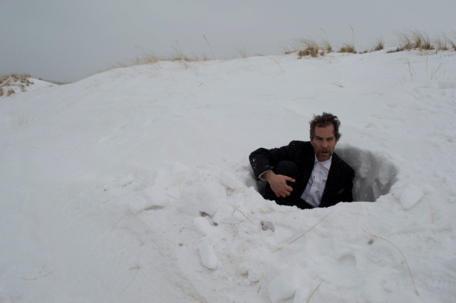 seated in snow hole.jpeg