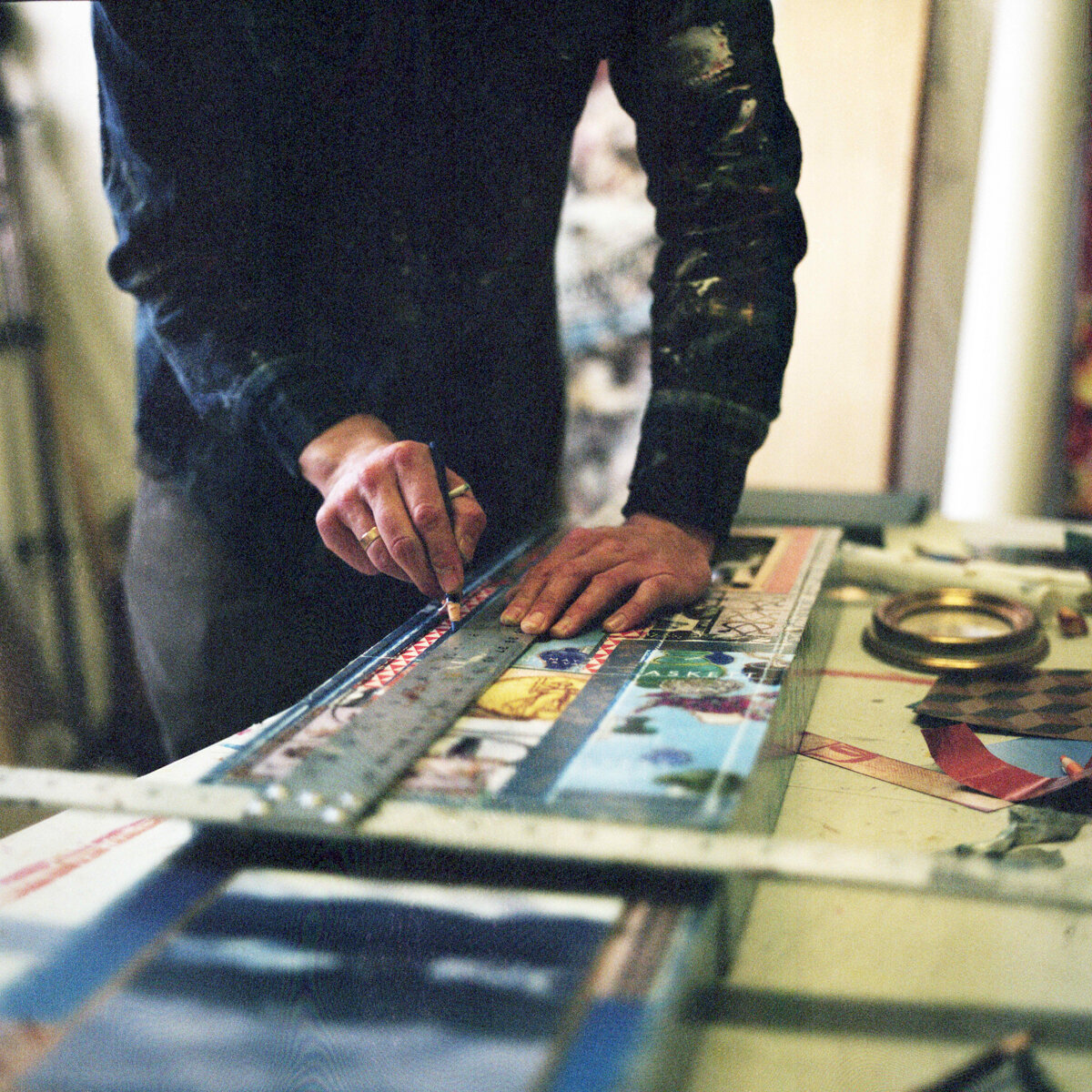 A detail of Montréal mixed media artist Gavin Sewell working in his Montréal studio.