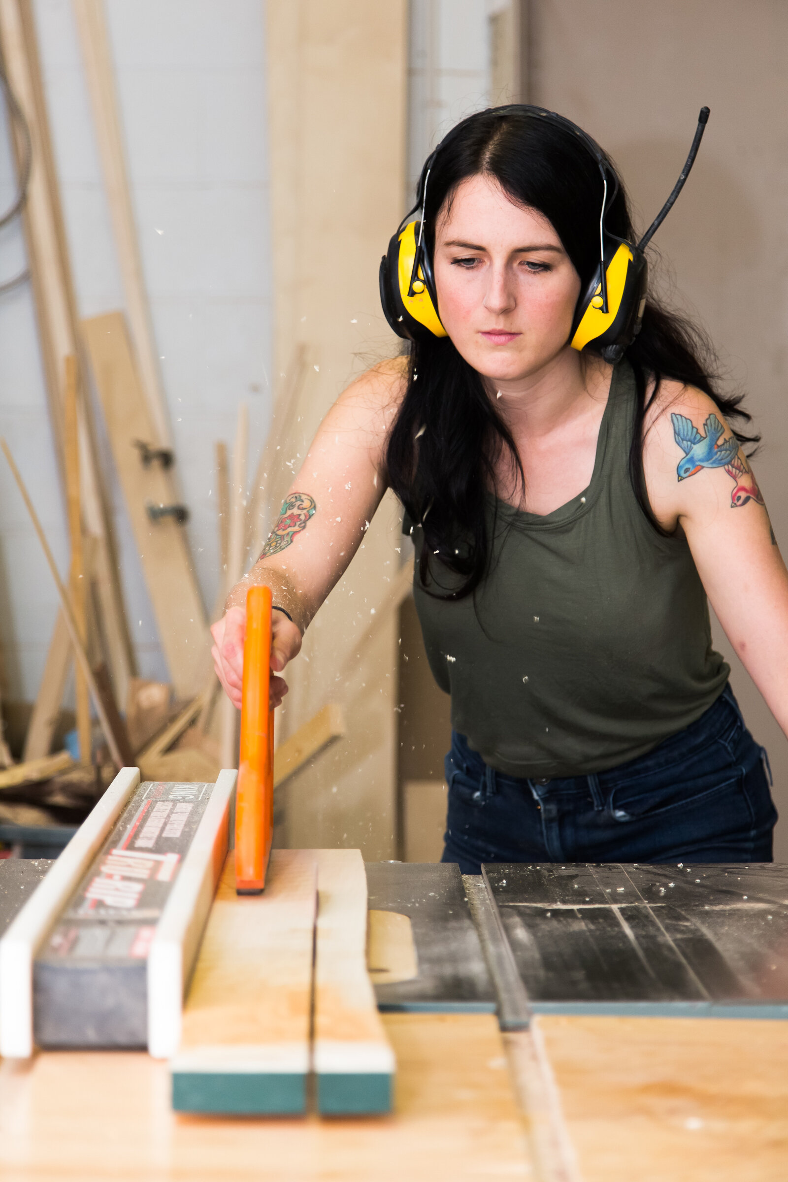 Woodworker Ashley West de Haas cuts wood to size to make a cutting board in her studio in Montréal, Canada.