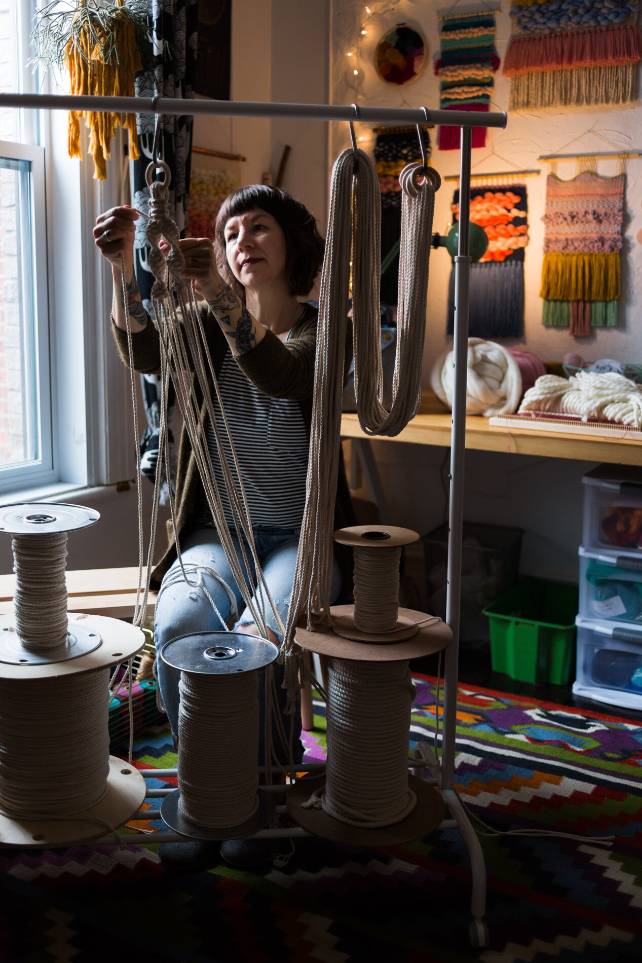 Jen Duffin (Nova Mercury) uses fibres and textiles to make hanging planters in her home studio in Montréal, Canada.
