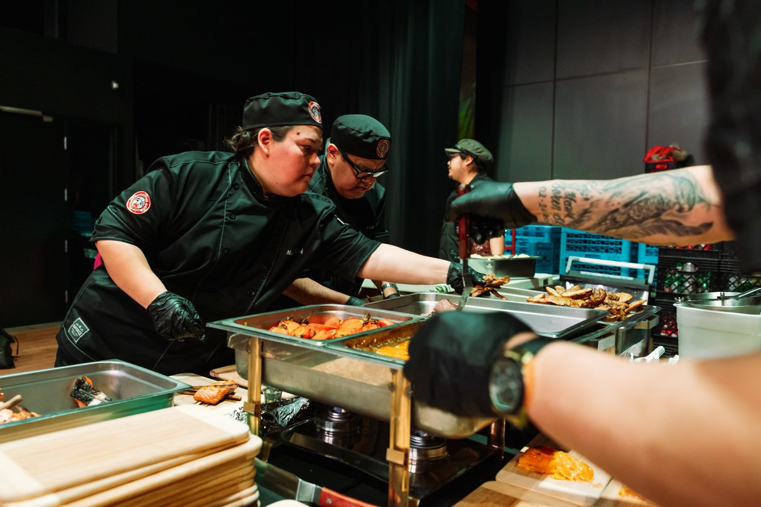 Chef Nola Mack and Chef Joseph Shawana are the epitome of calm in the midst of a busy kitchen as they plate dishes at the "Food for Good" event hosted by the Nature Conservancy and Nature United for COP15 in Tiohtià:ke (Montréal, Canada) entirely ma