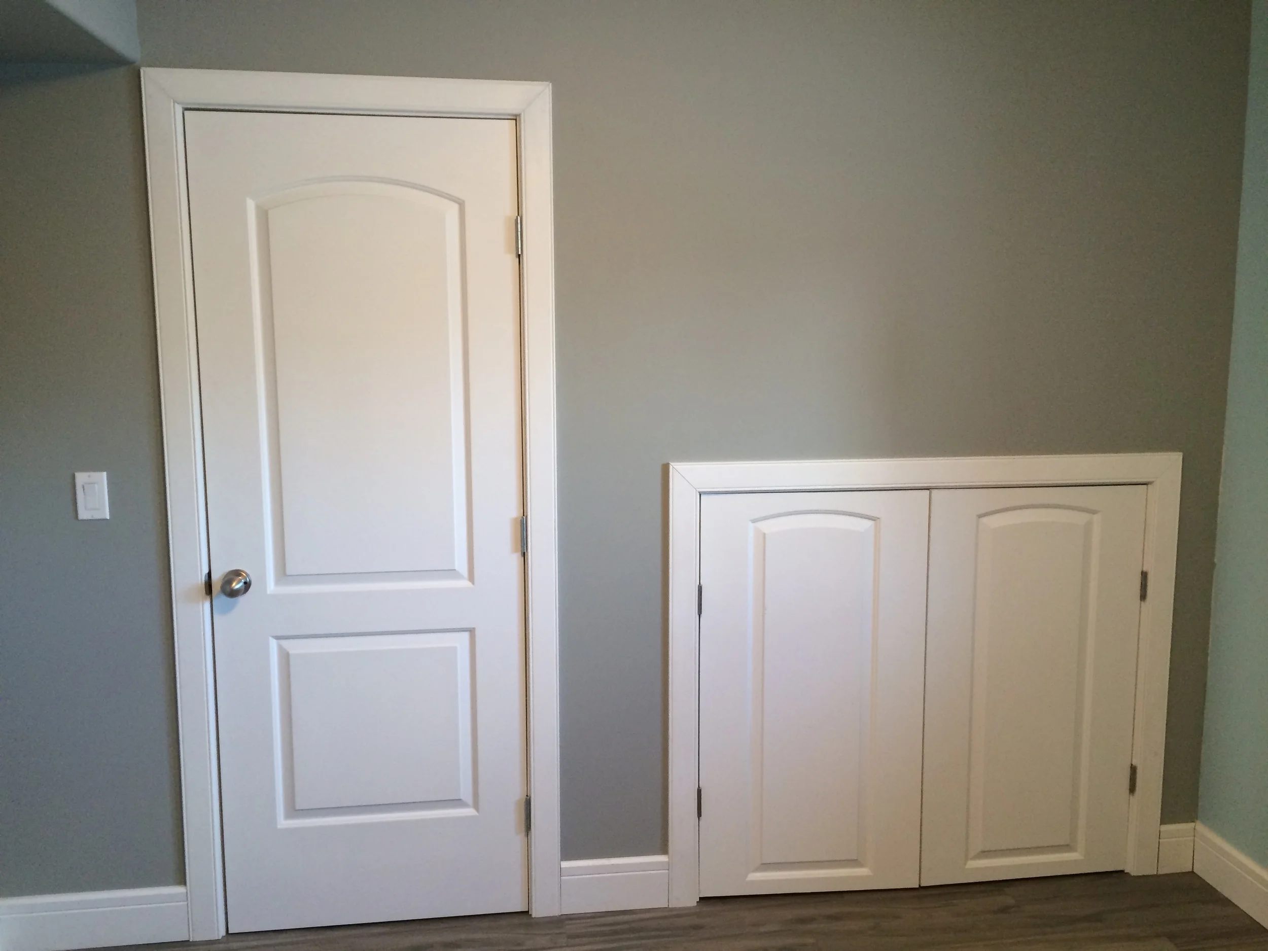 Basement renovation Saskatoon, bedroom, custom closet, french doors, flooring, trusted contractor
