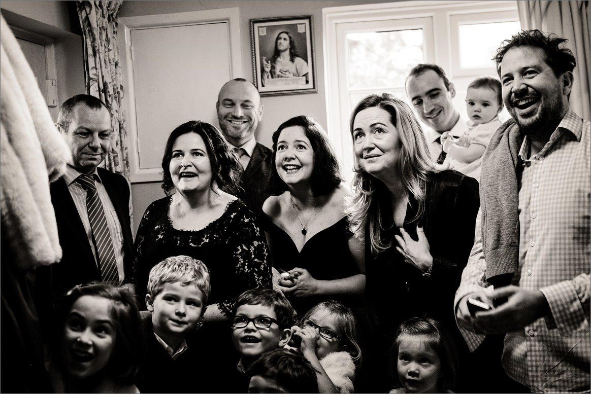 The reaction on their faces as the bride arrives downstairs is priceless