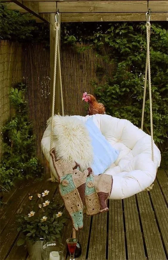 For those who have the gift of sunrooms in their apartments or houses, this would be a great addition. Hang a papasan cushion or hammock from a corner in the space, and add your favorite blanket for extra comfort. Plants and healthy greenery put a level of serenity and inspiration into the room as well, so you can finish that novel you've been working on the past couple months. Aromatherapeutic candles could be lit in a safe place nearby for when the storm really sets in. And don't forget your farm chicken. They like to read, too. 