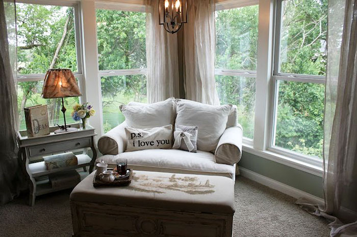 This little living room corner just whispers rainy day laziness. Set up a love seat or your armchair of choice near some windows like this one. This property is surrounded by trees, and if yours is similar, then you're in luck. The wind and rain blowing through the trees will emulate ocean waves -- a nice solution to that beach dream you keep having at your work desk. There may not be sand around, but there's plenty of water. The only thing missing is your imagination, which is why we're catching up on our reading this rainy weekend.