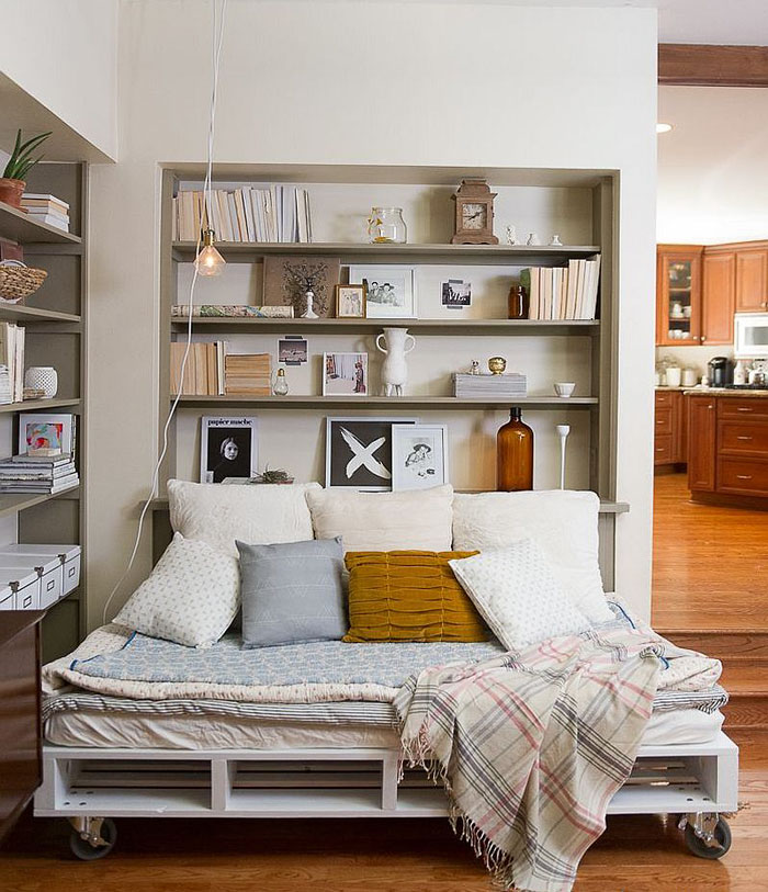 If you need me, I'll be lounging in my bed-with-wheels, listening to Edith Piaf on vinyl and catching up on what Nancy Drew is up to today. I love the simplicity of the lighting fixture and shelving. Even though nothing matches, everything matches, you know?