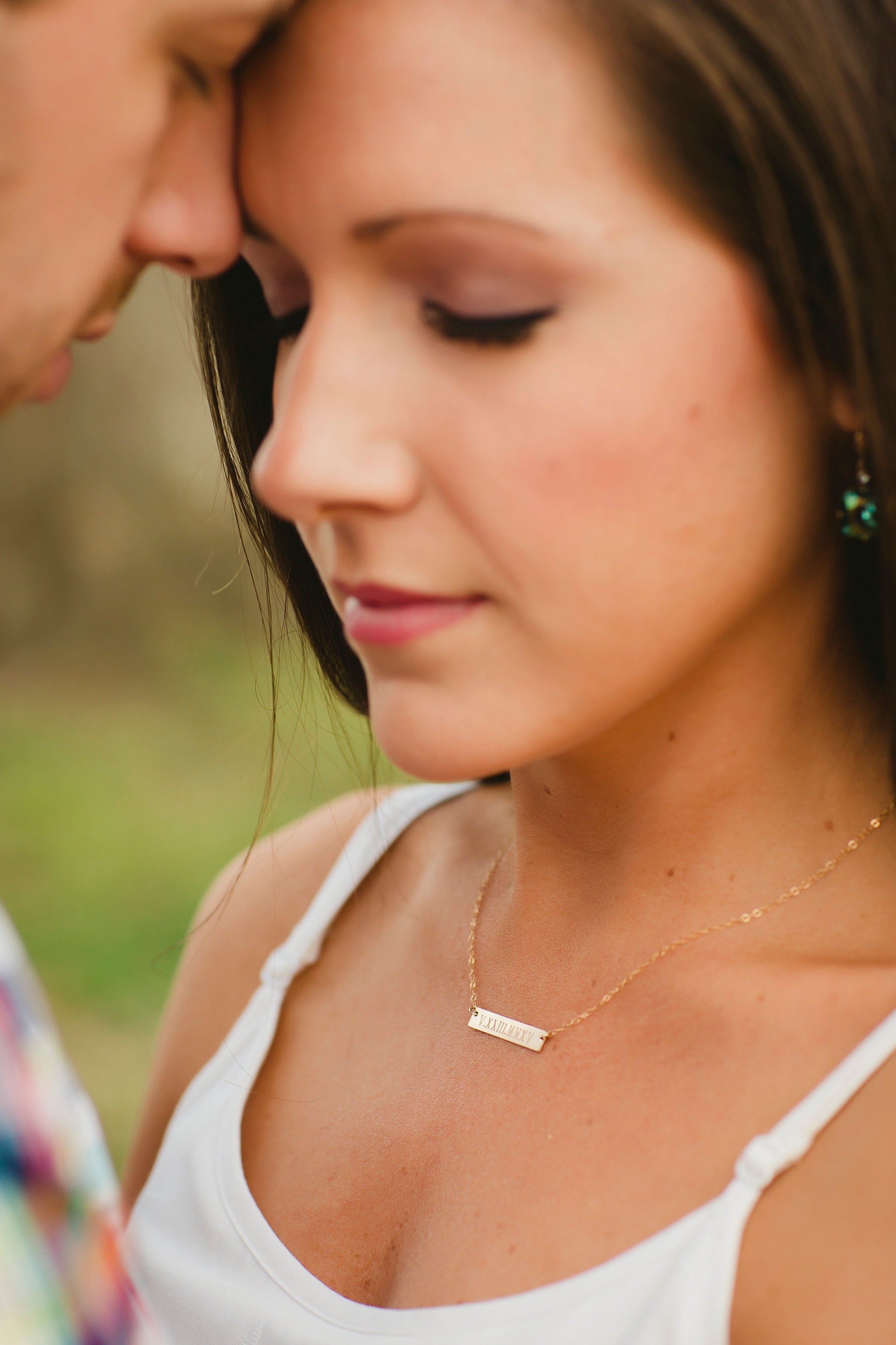 Jessica's friend ( Caroline Taylor Jewelry ) made this necklace for her. It has the roman numerals of their wedding date etched into it. Really really cool idea. 