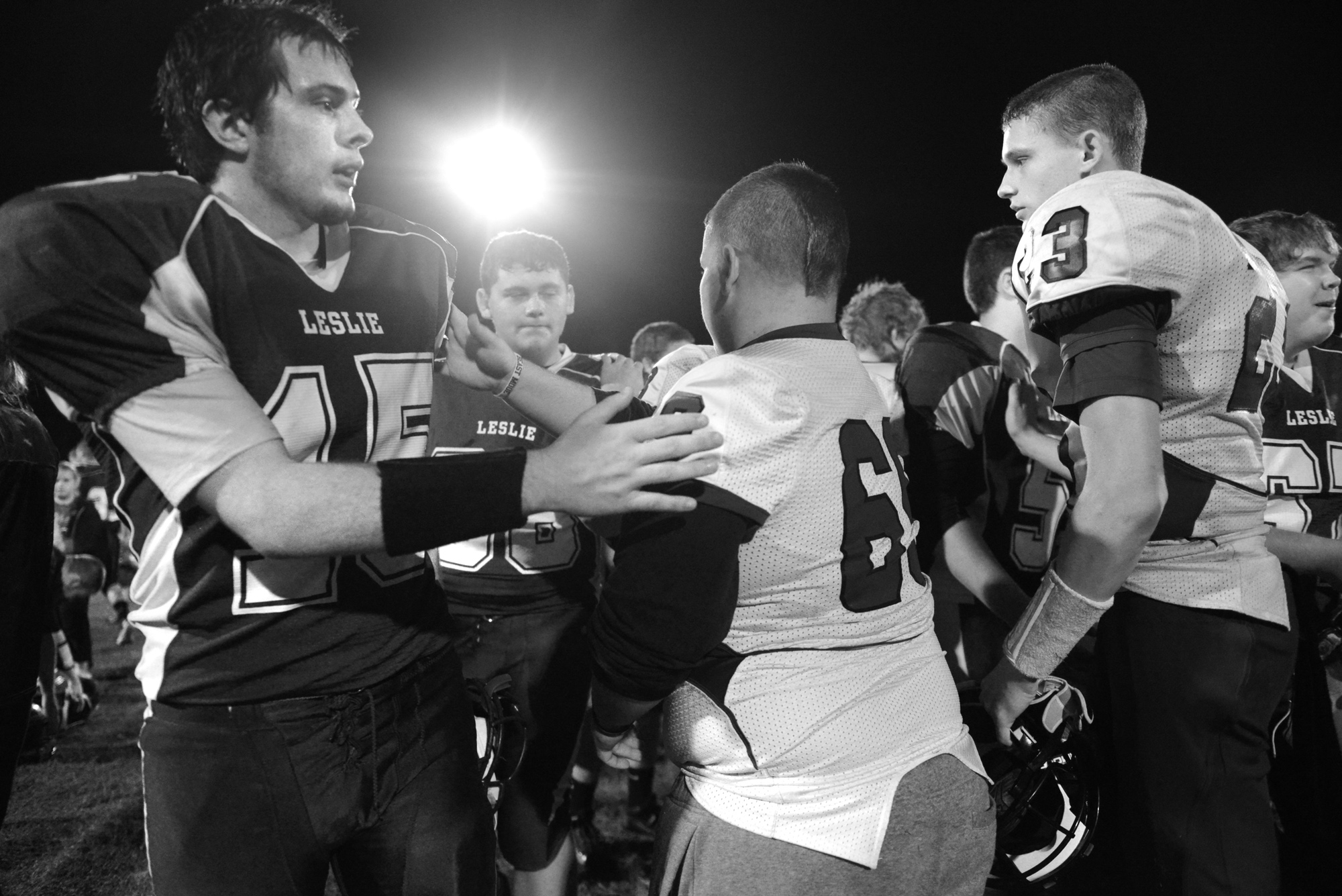 Players exchange handshakes after the Leslie County Eagles' loss.