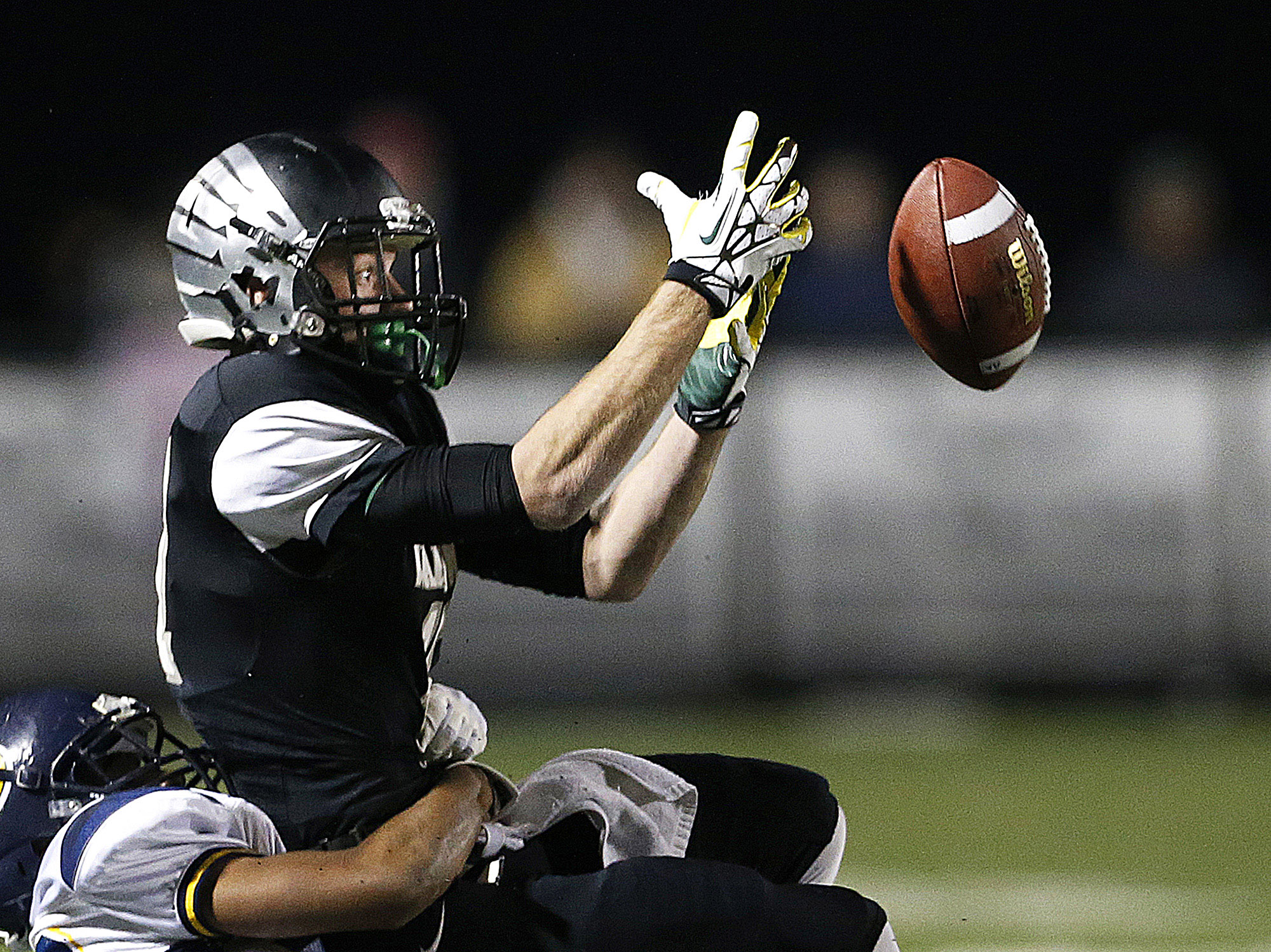 Westerville Central senior receiver Lucas Irwin is unable to receive a pass from senior quarterback Nate Jackowski in the second quarter, at Westerville Central High School against Solon High School, Saturday, November 8, 2014.