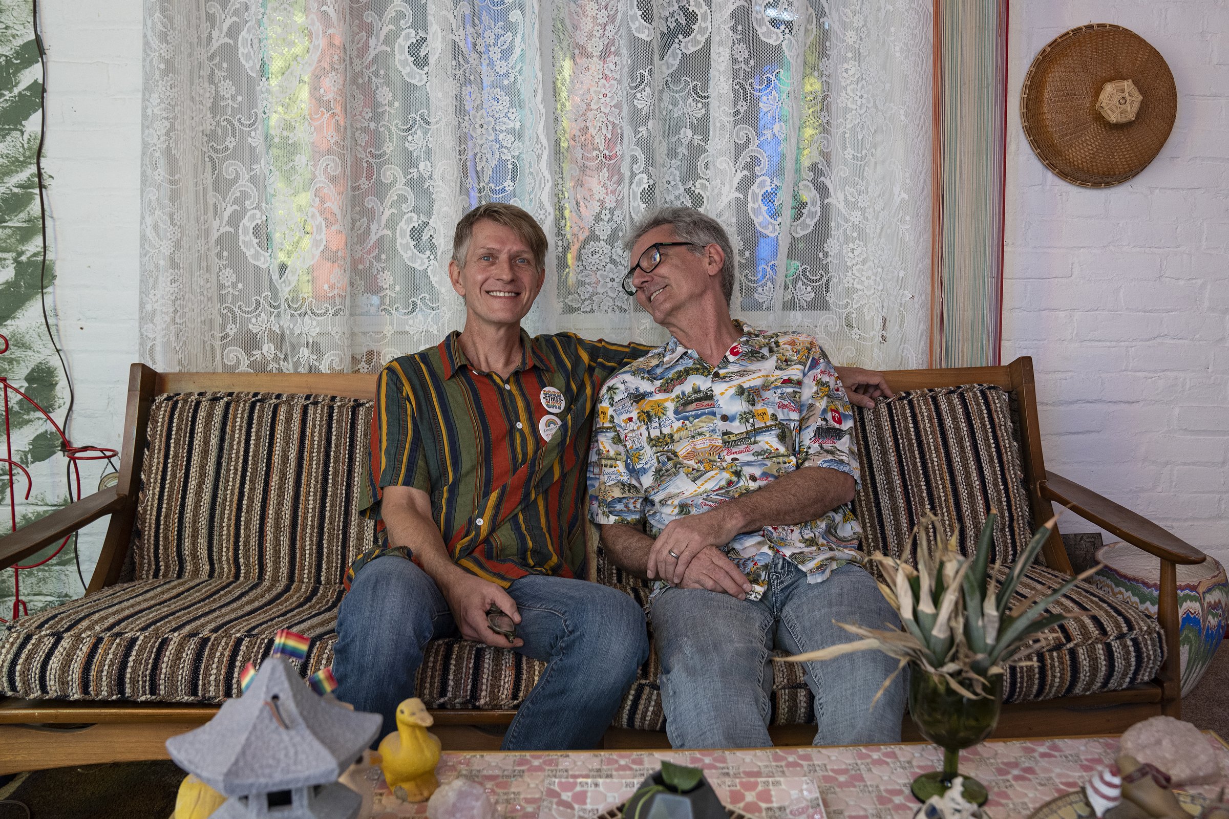  Tracy, 57, and Tim Brown-Salsman, 59, residents of Loogootee, Indiana, pose for a portrait at home on Thursday, July 14, 2022. The married couple has lived in Loogootee, which is Tim's hometown of about 2,500 people, since 1997. "It's the small comm