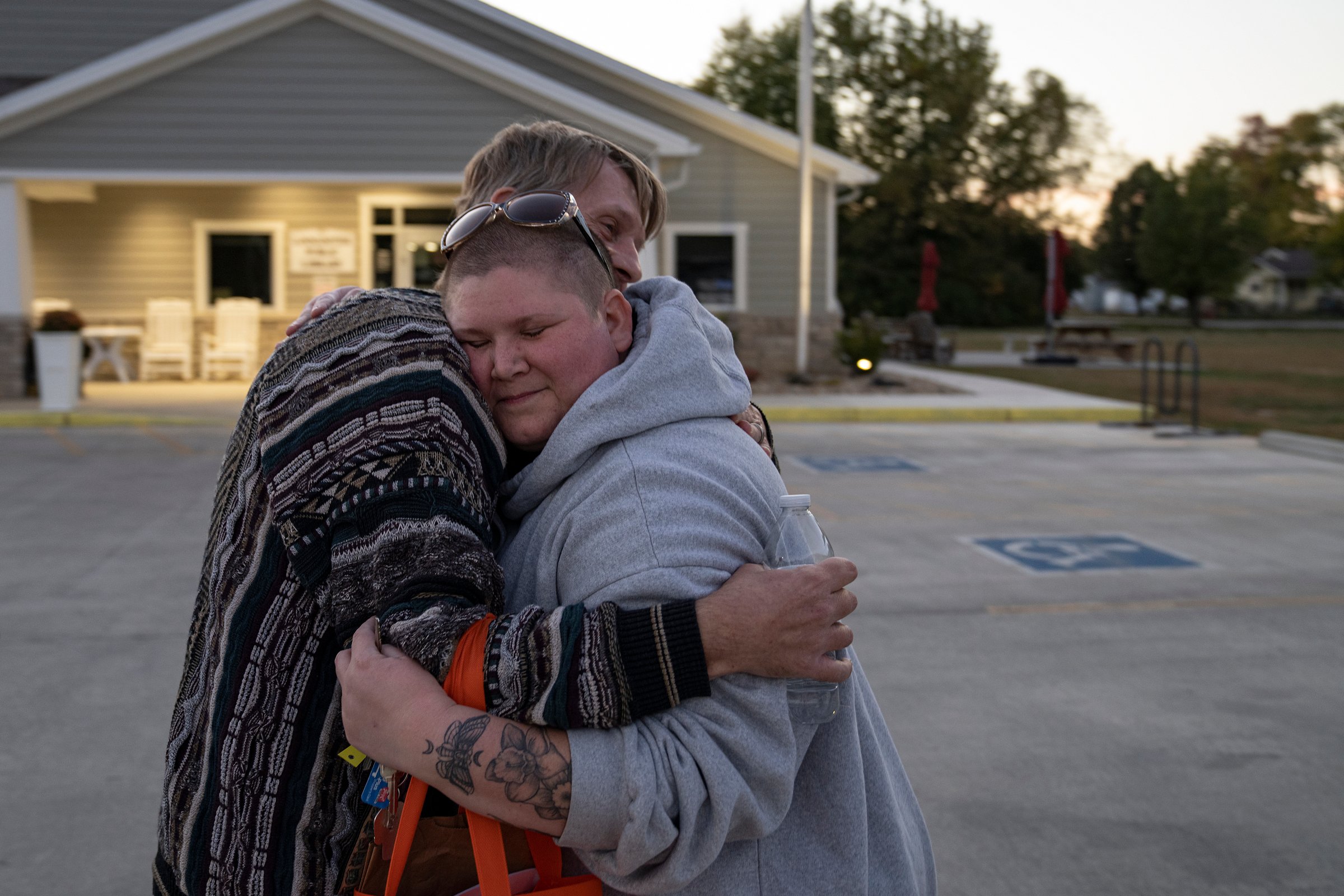  Kayla Whaley hugs Tracy Brown-Salsman after a Loogootee Pride meeting at the town's library on Thursday, Oct. 20, 2022. Whaley moved back to her hometown of Loogootee in 2016 but didn't become friends with Tim and Tracy until 2019. "I really didn't 