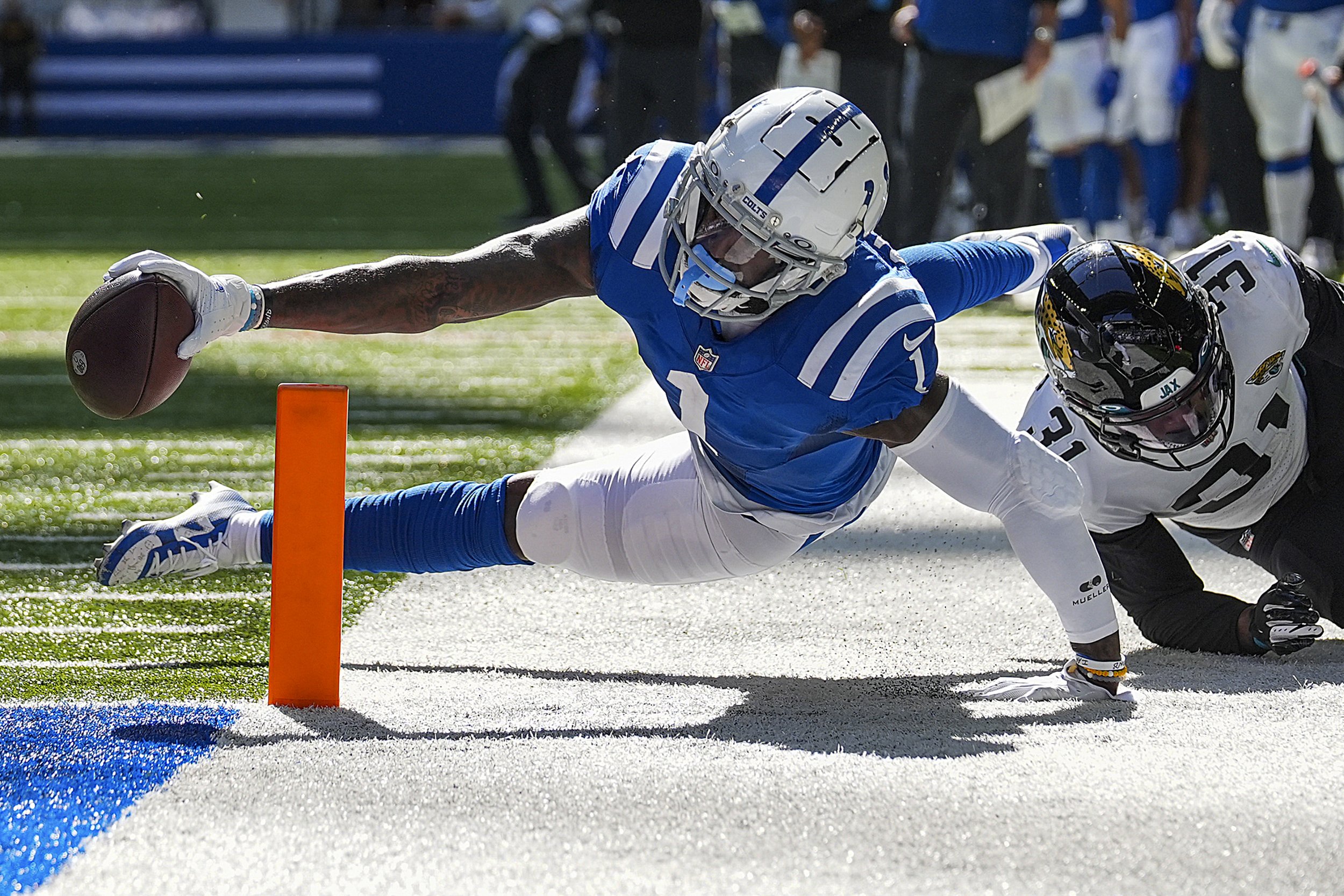  The Indianapolis Colts wide receiver Parris Campbell (1) reaches to keep the ball inside the pylon for a touchdown as he's tackled by Jacksonville Jaguars cornerback Darious Williams (31) on Sunday, Oct. 16, 2022, during a game at Lucas Oil Stadium 