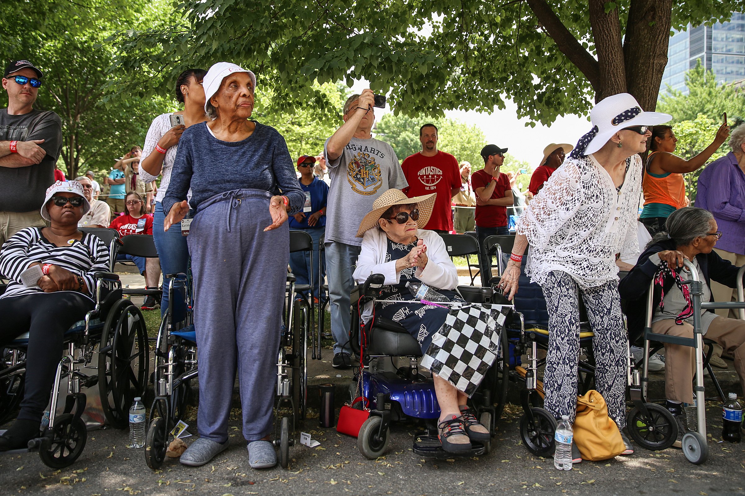  Elderly spectators watch as the 500 Festival Parade passes through downtown Indianapolis, Saturday, May 26, 2018. The mid-day parade takes place a day before the Indy 500 mile race.  