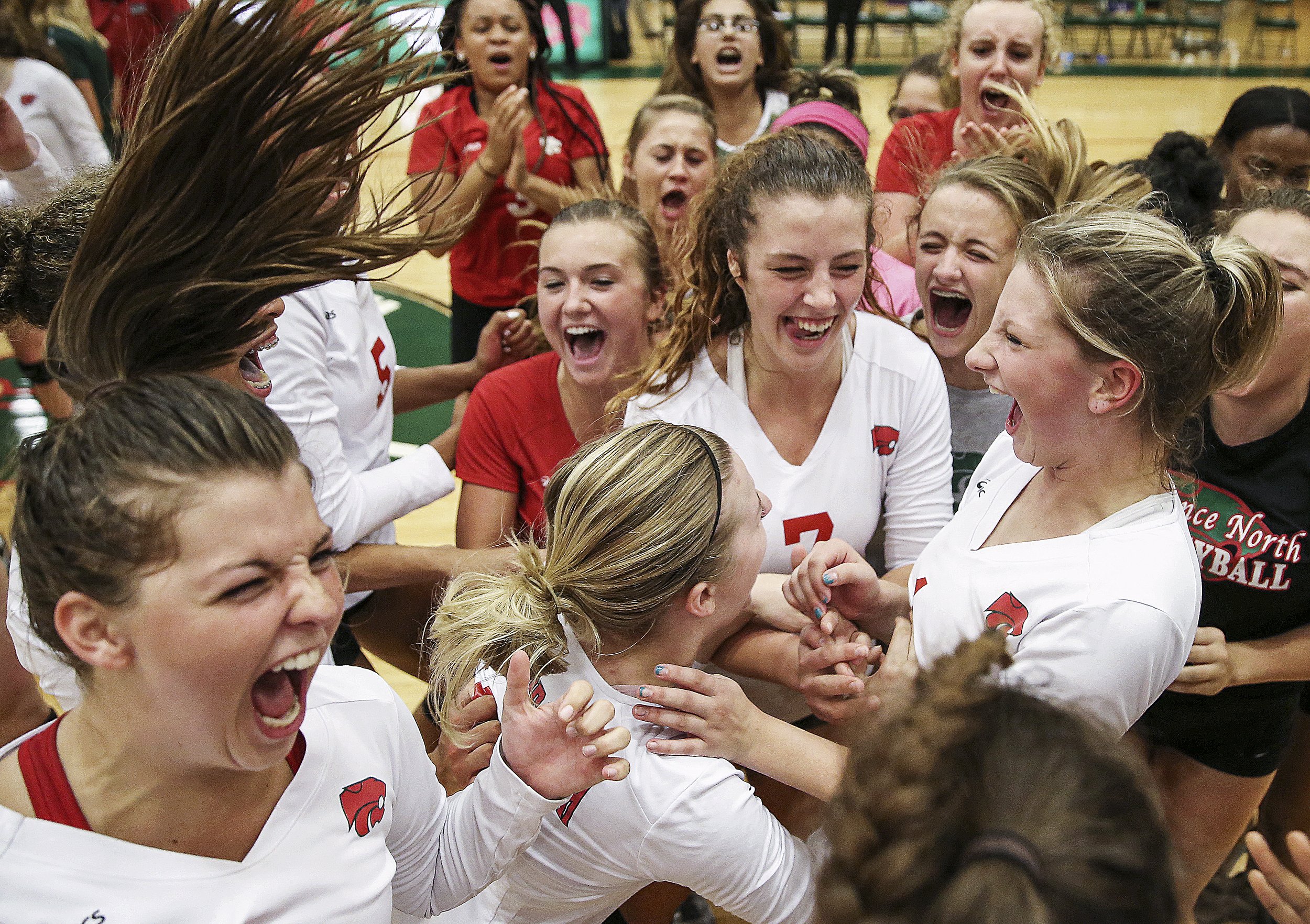  Lawrence North celebrates after defeating Cathedral in the fifth set at Lawrence North High School, Indianapolis, Thursday, September 8, 2016. 