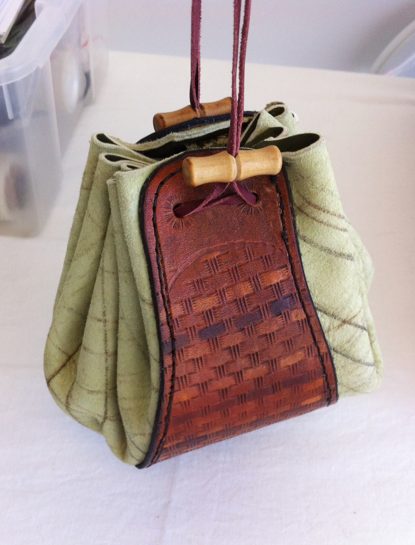 Soft leather mixed with carved veg-tan leather to make a drawstring pouch I purchase a small selection of soft leathers at the beginning of each year