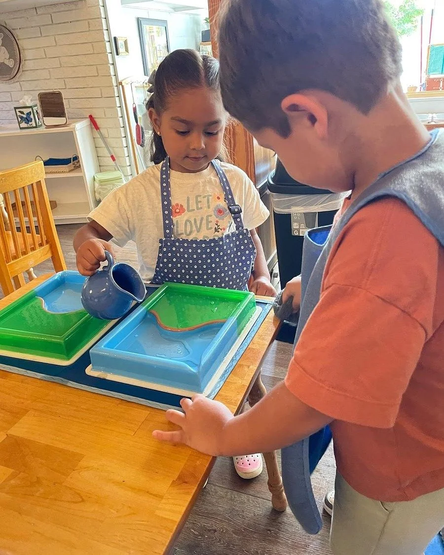 In the Montessori primary classroom, geography is a tactile, hands-on experience. Through the Land and Water Forms lesson, children explore physical geographic concepts long before they ever memorize them from a textbook.

Using 3D tray models, child