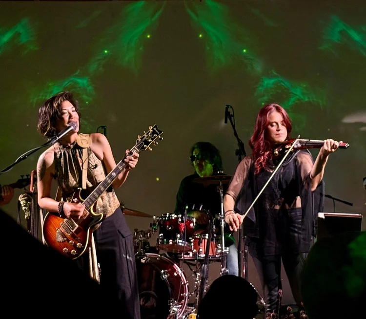 Dolce Wang playing guitar and Nathalie Bonin playing violin together at Venia.