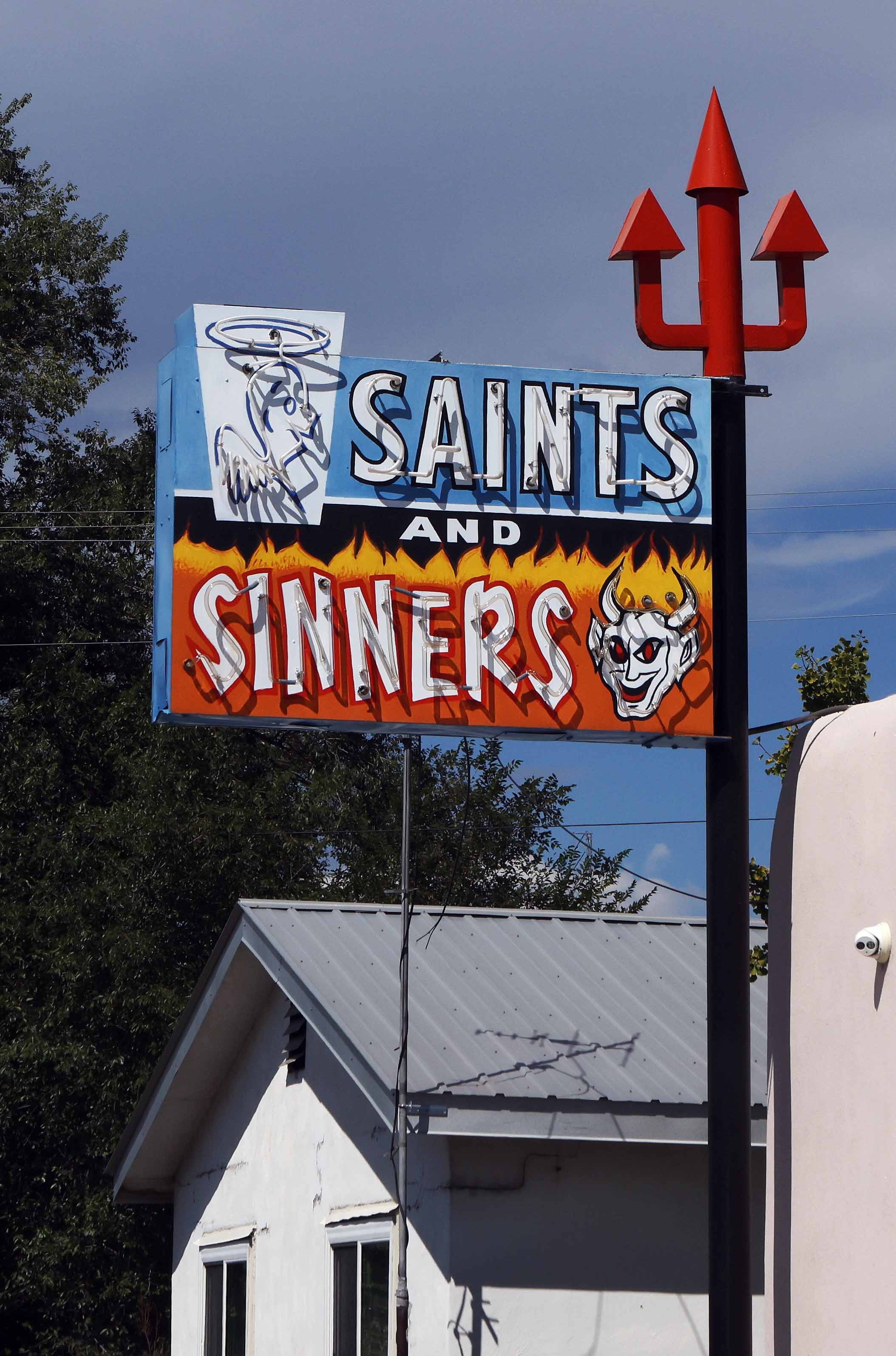 Sign Saints and Sinners NM roadside crp lavo 9.23.jpg
