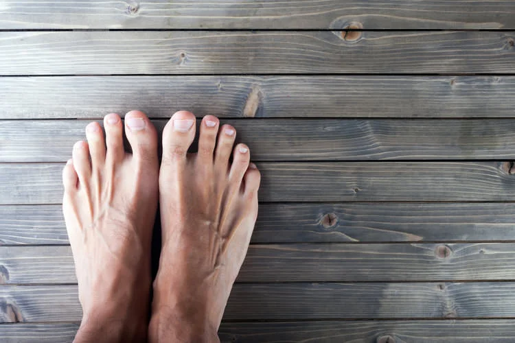 bare feet on a wooden surface.jpg