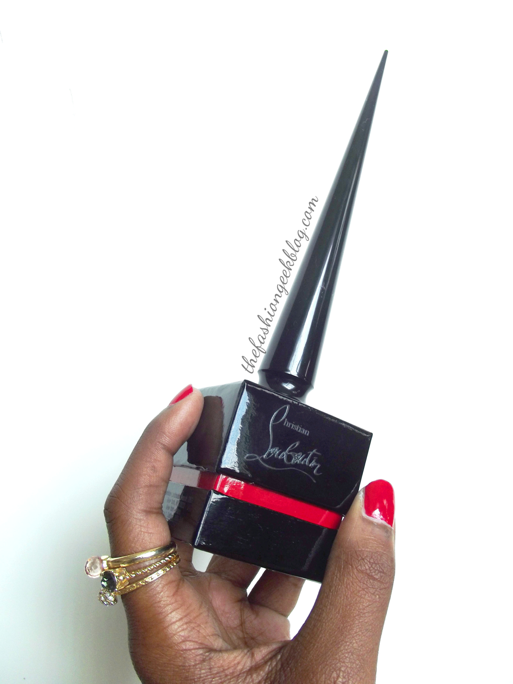 The bottle comes in a shiny black and red box engraved with the Christian Louboutin signature logo. There is an opening at the top of the box to accommodate the tall brush handle.