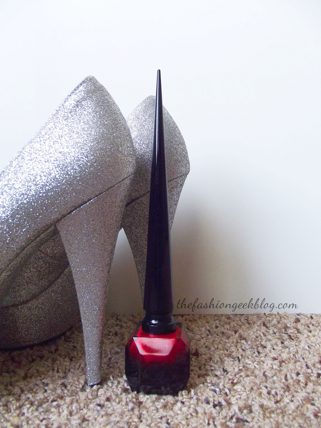 Christian Louboutin's Ballerina Ultima heel is said to be approximately 8 inches tall. I don't own any Loubies right now, but I wanted you to see the height of the bottle compared to the height of a normal pair of platform heels (it's slightly taller by a few centimeters).