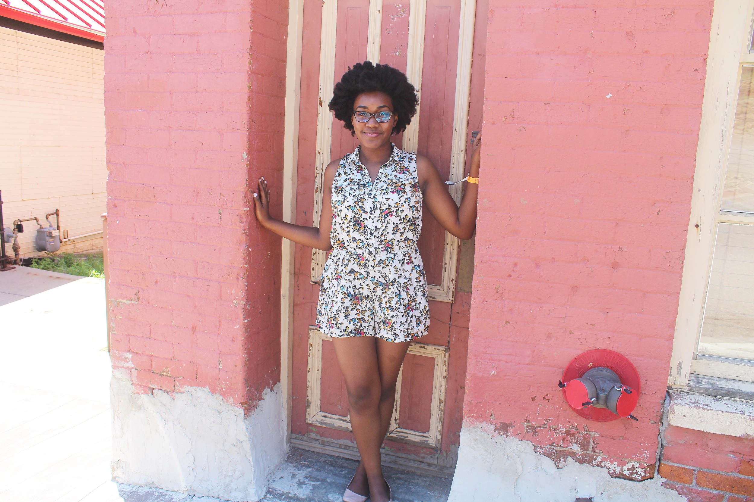 Me in front an empty building in Central City in Topshop romper.