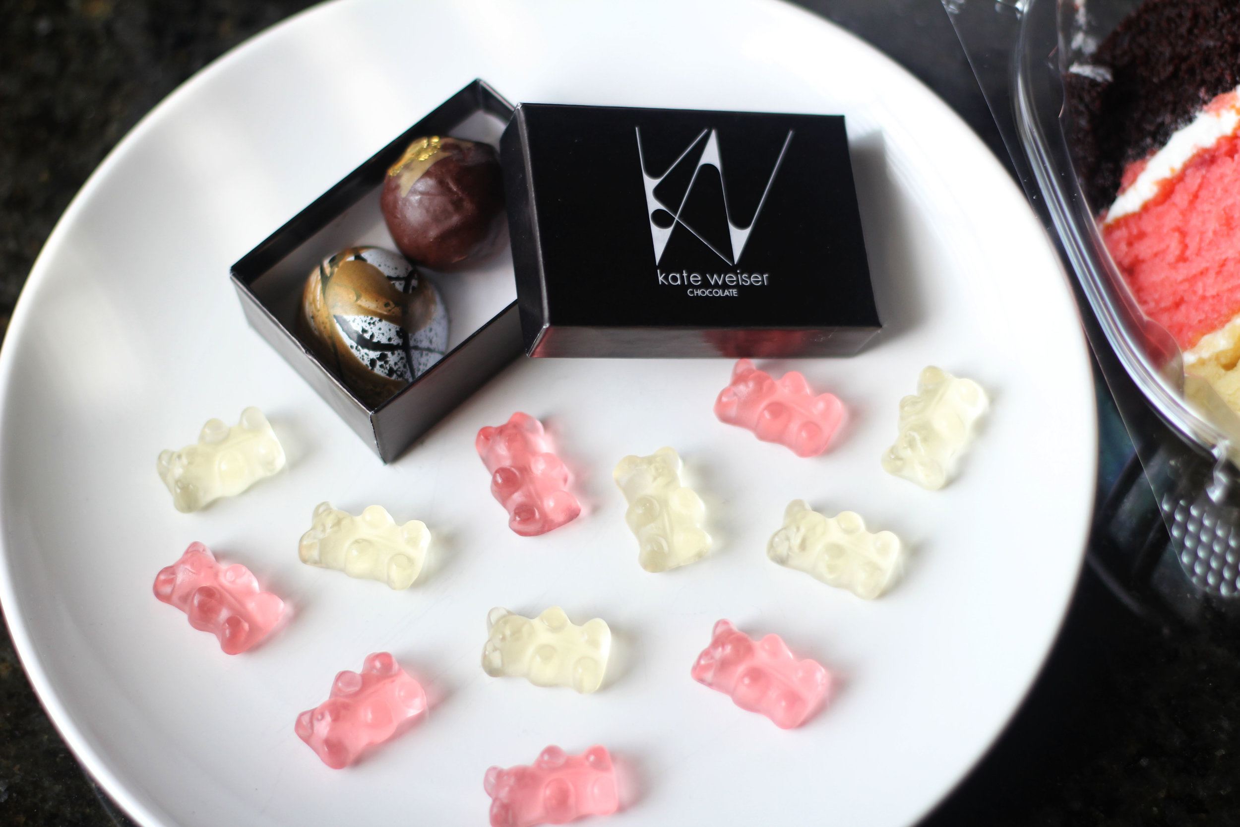 Kate Weiser chocolate from Trinity Groves and Baby Champagne Bears infused with Dom Pérignon Vintage Champagne (Brut & Rosé) from Sugarfina at Market in Highland Park Village.