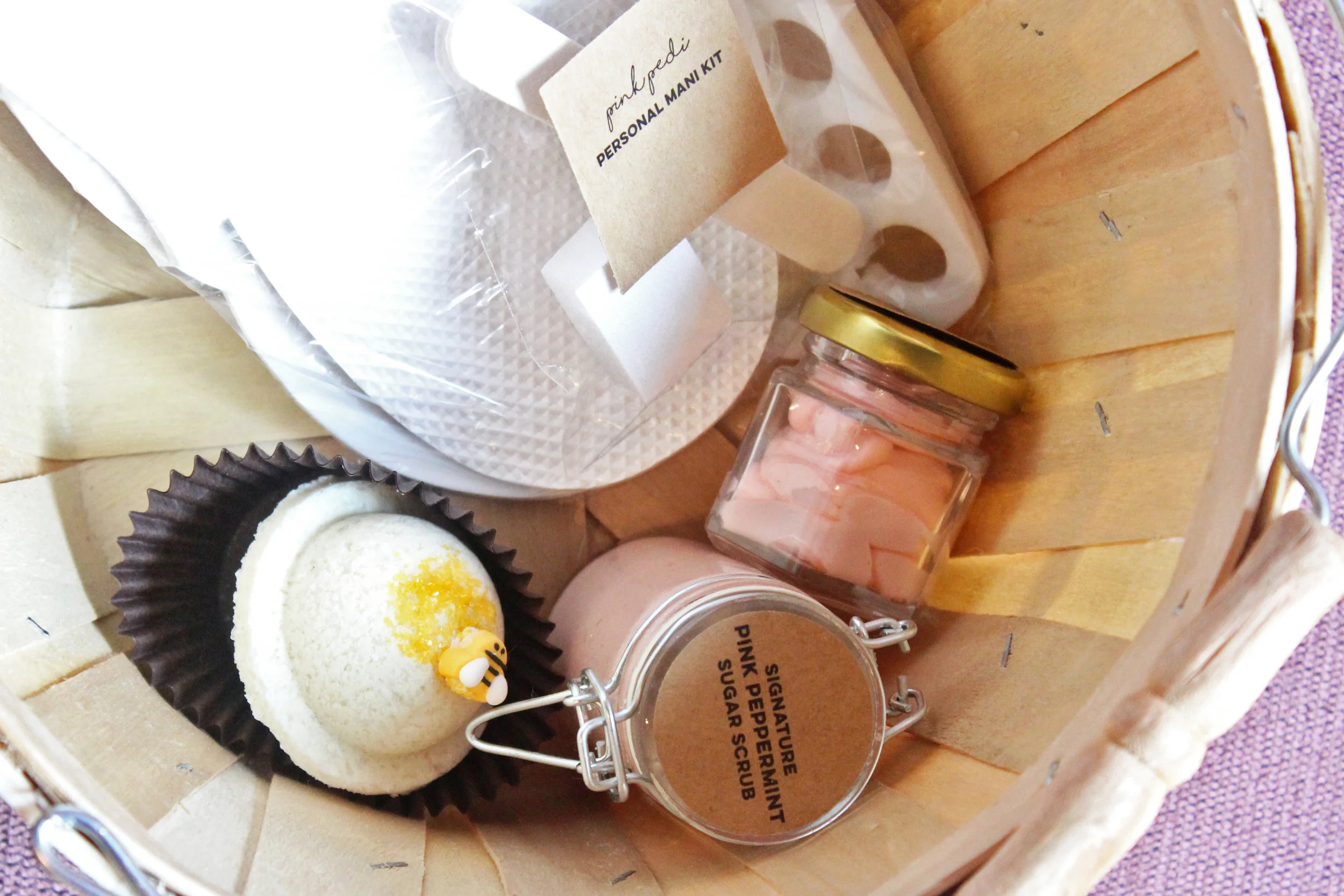 My customized basket at Pink Pedi with clean pedicure tools and my choice of a bath bomb, sugar scrub, and body butter.