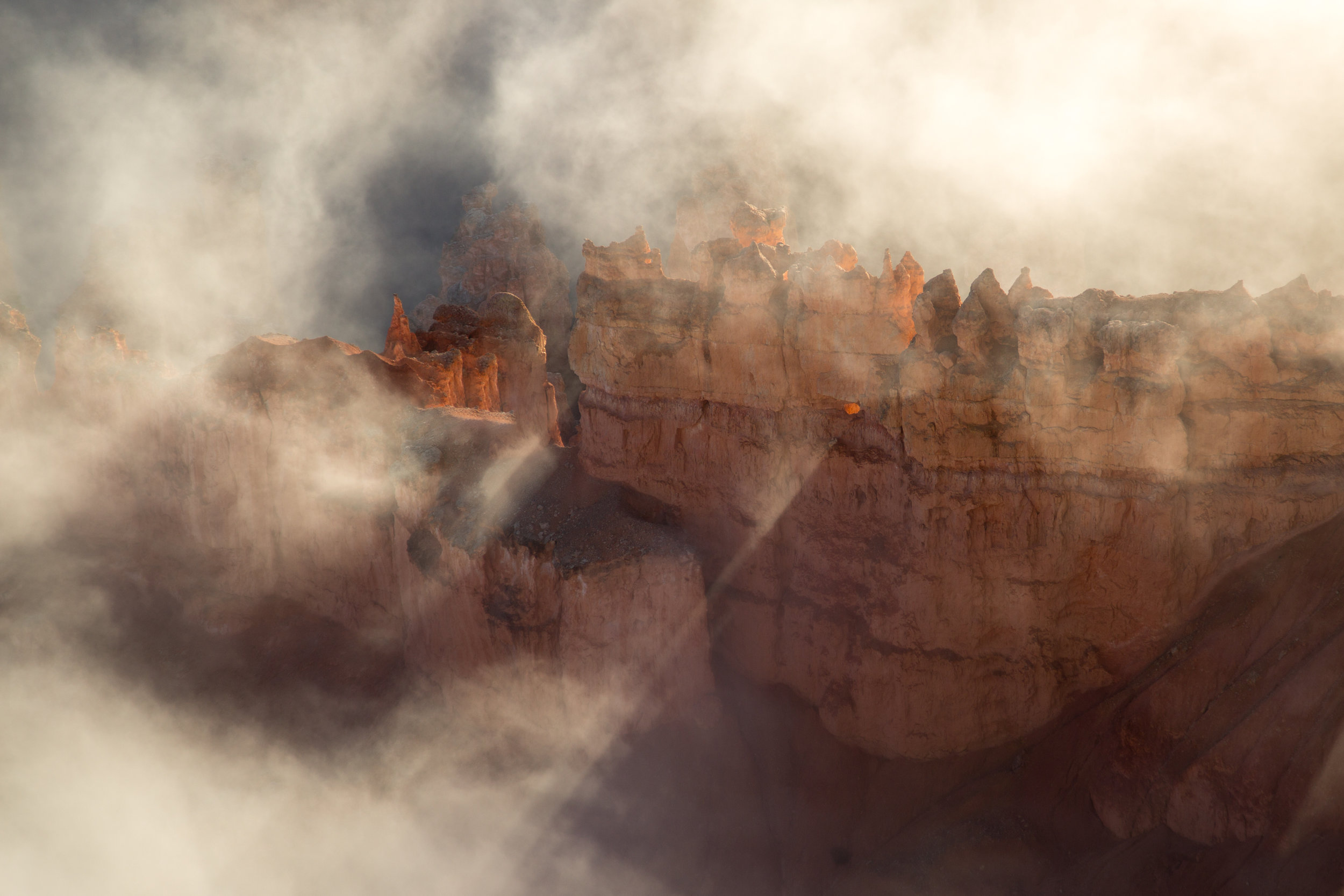 Bryce National Park with Reflected Light and Fog at Sunrise