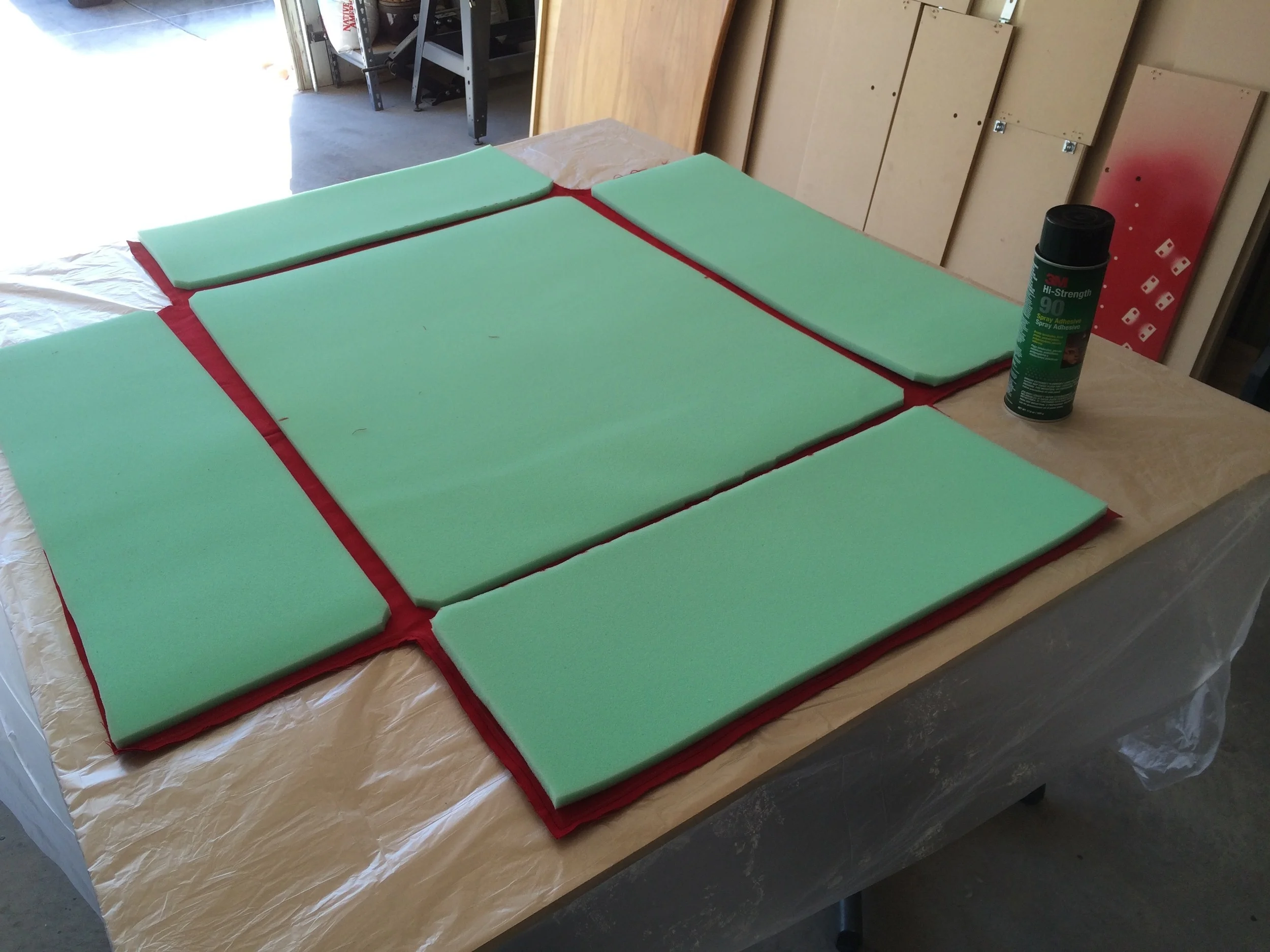 Foam being glued into inside-out padding cover fabric