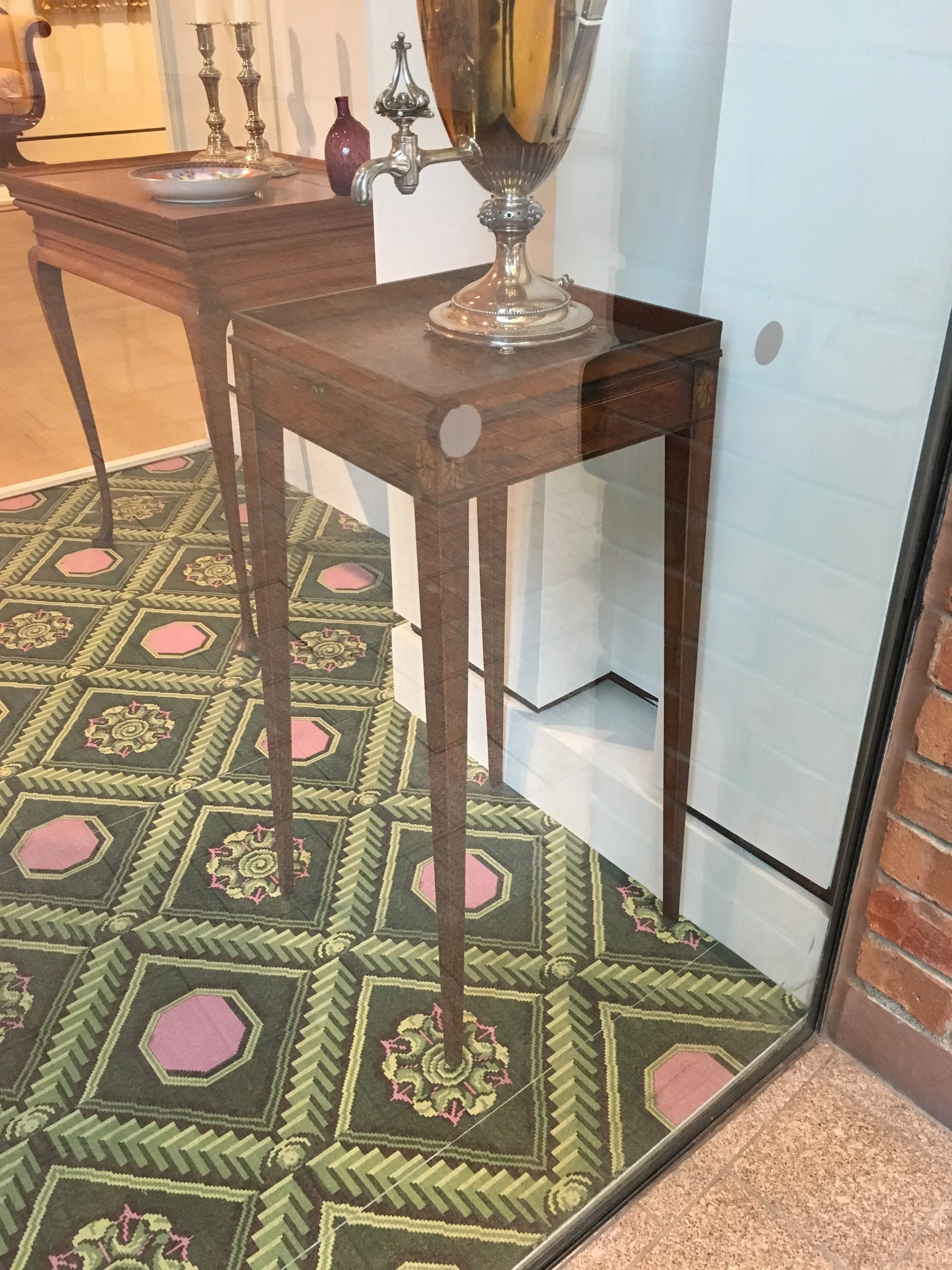  The table that inspired it all! It caught my eye with its tapered legs, subdued square moulding, and elegant recessed top. What can I say? It was love at first sight. Good thing it was behind glass, because I wanted to get my hands on it! 