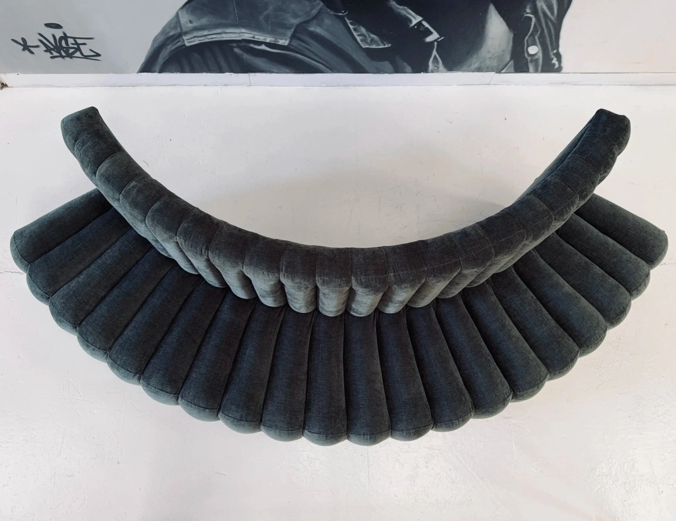 A combination of the convex, curved shape with top-to-bottom fluting, tapering outwards on the seat certainly added some challenges from an upholstery perspective! 
Joins were strategically sewn to minimise ripples and puckering in the fabric - a lot